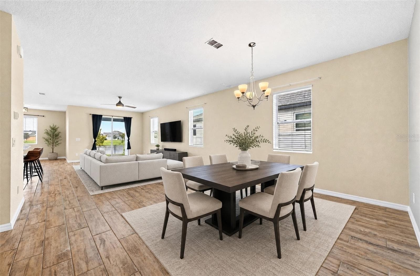 **Virtually Staged** Spacious open-concpet living/dining room as you enter the home - 880 LIVESTOCK LOOP, ST CLOUD