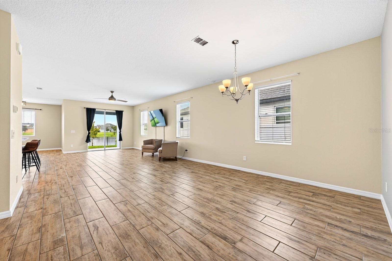 Welcome in to your new home! Look at that natural light and HUGE space with gorgeous porcelain wood-looking tile throughout! - 880 LIVESTOCK LOOP, ST CLOUD