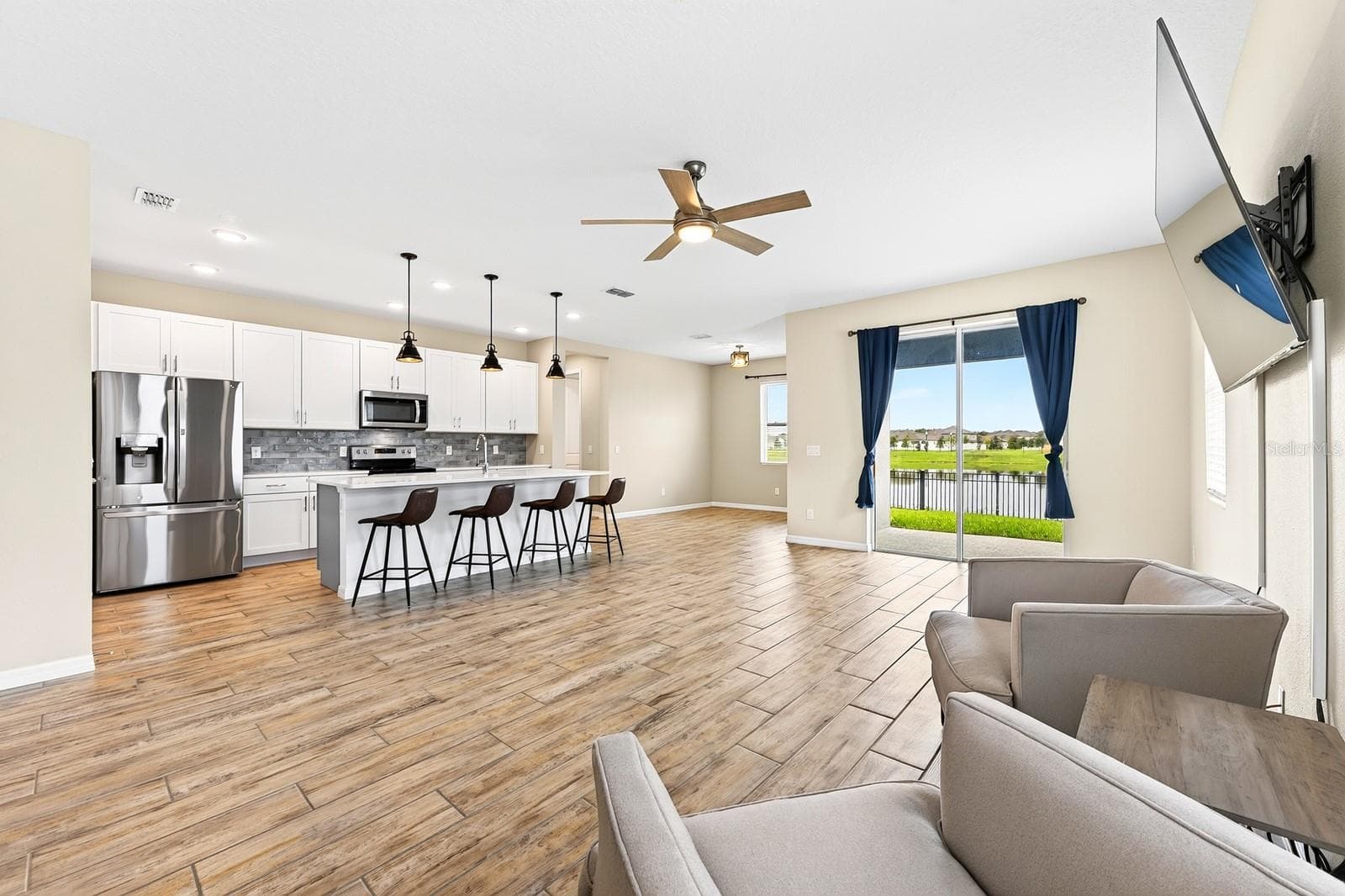 There is a ton of natural light and the TV conveys with the sale! - 880 LIVESTOCK LOOP, ST CLOUD