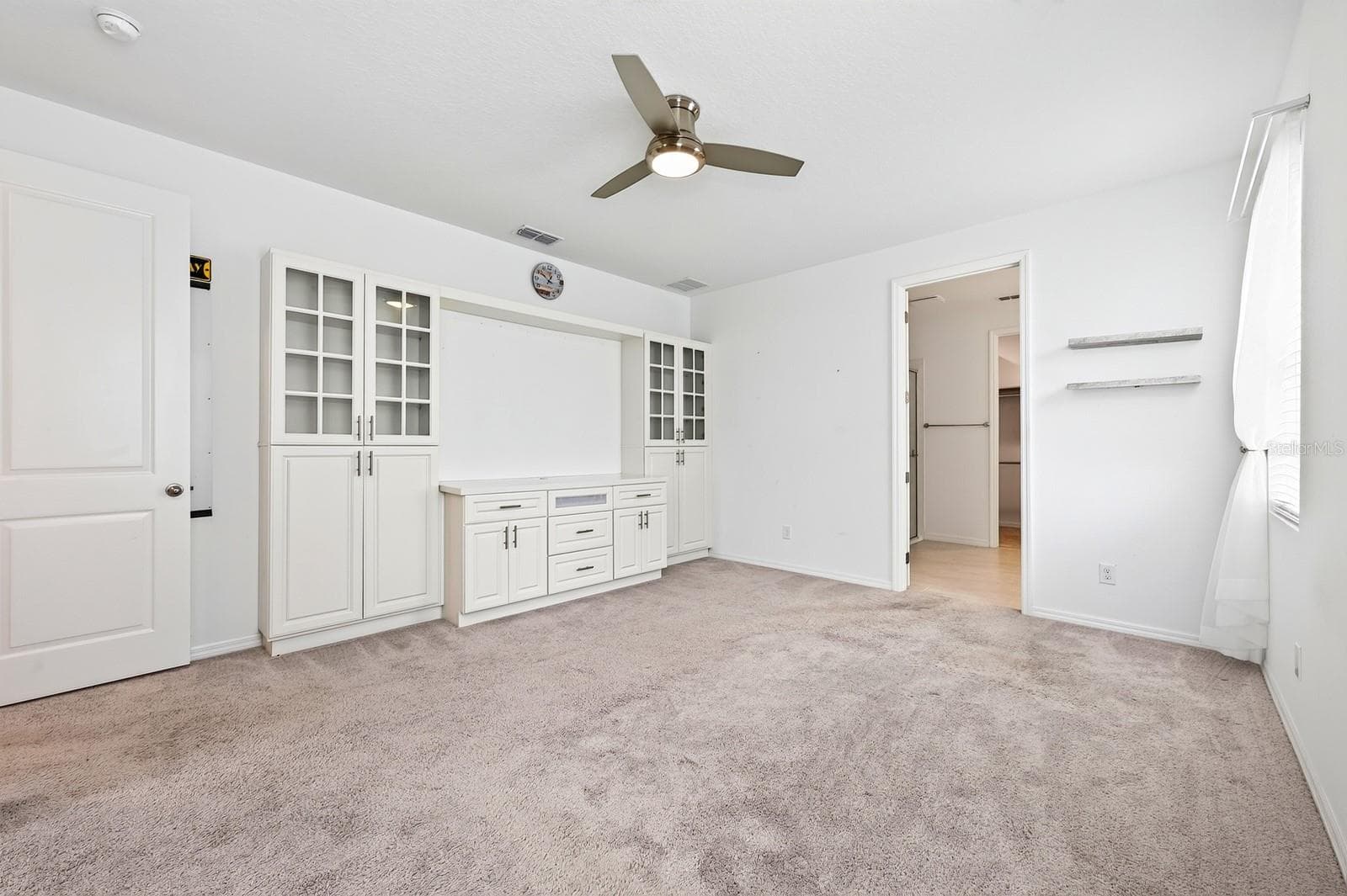 Welcome to your RETREAT! There are incredible built-ins with display space and flexible storage. The opening in the middle is perfect for a TV too! - 880 LIVESTOCK LOOP, ST CLOUD