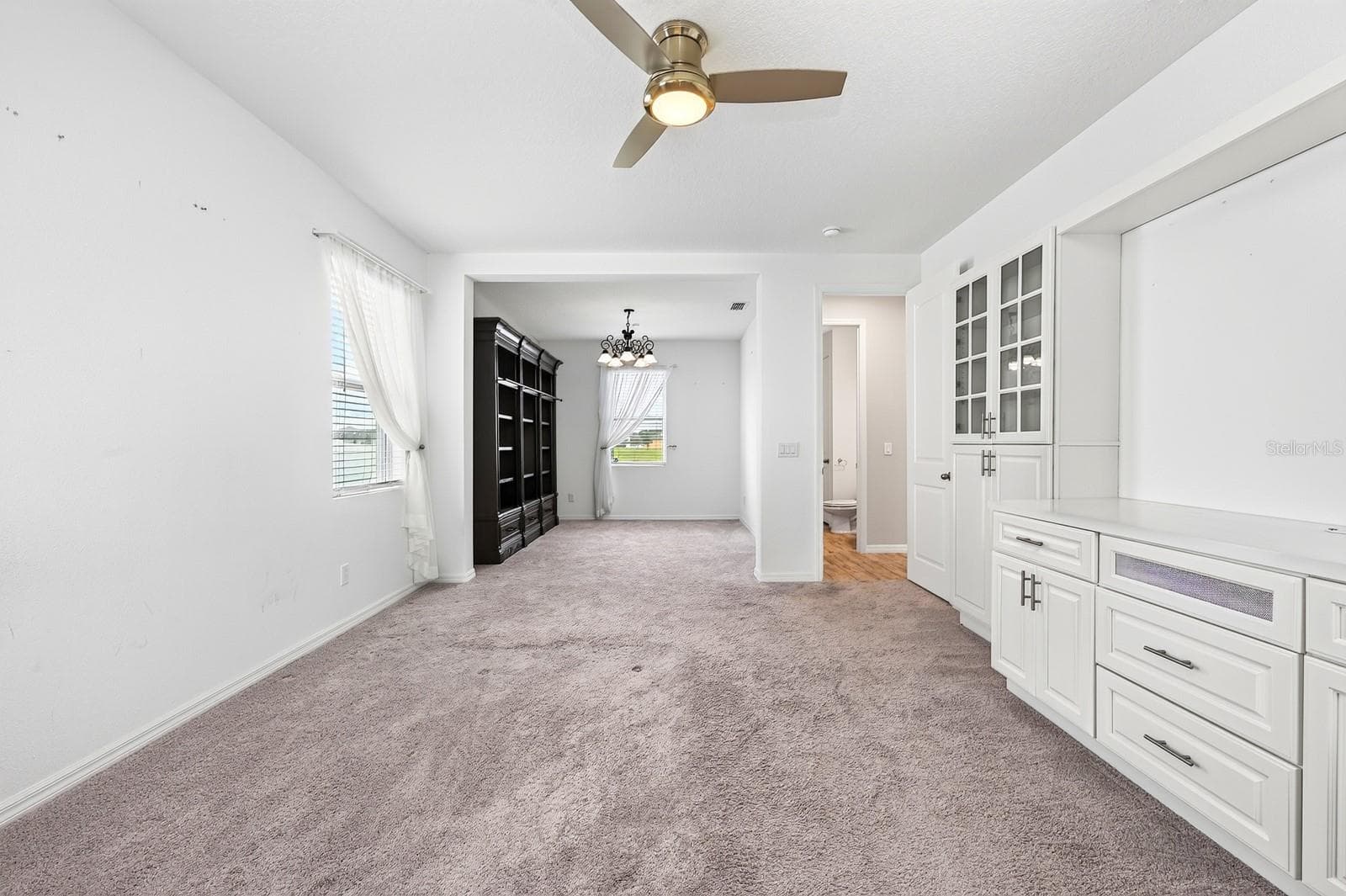 Check out those drawers under the TV (or artwork) space along with the natural light from the 2 windows - 880 LIVESTOCK LOOP, ST CLOUD