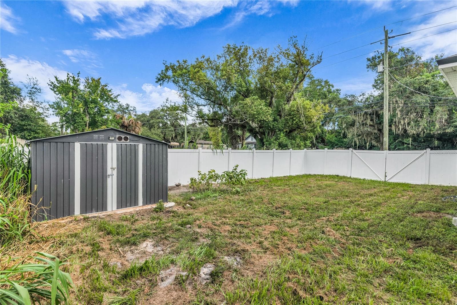 Fully fenced in back yard with storage shed - 3954 S SANFORD AVE, SANFORD