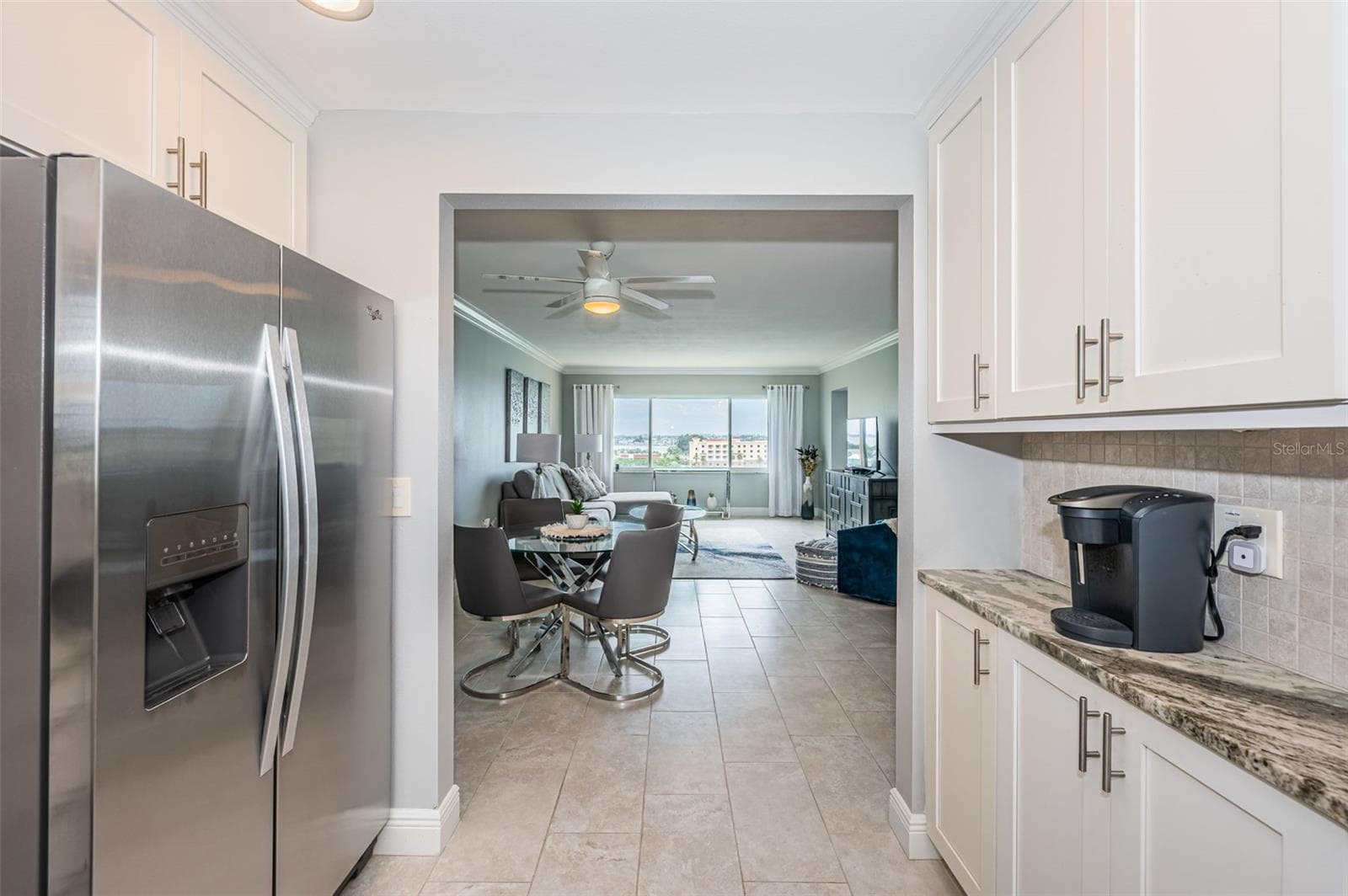 Open kitchen with pantry and lots of cabinets - 4775 COVE CIR #904, ST PETERSBURG
