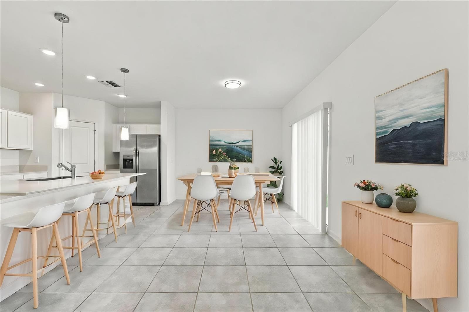 Kitchen and Dining Area - Virtually Staged - 997 HAROLD PASS, WINTER HAVEN