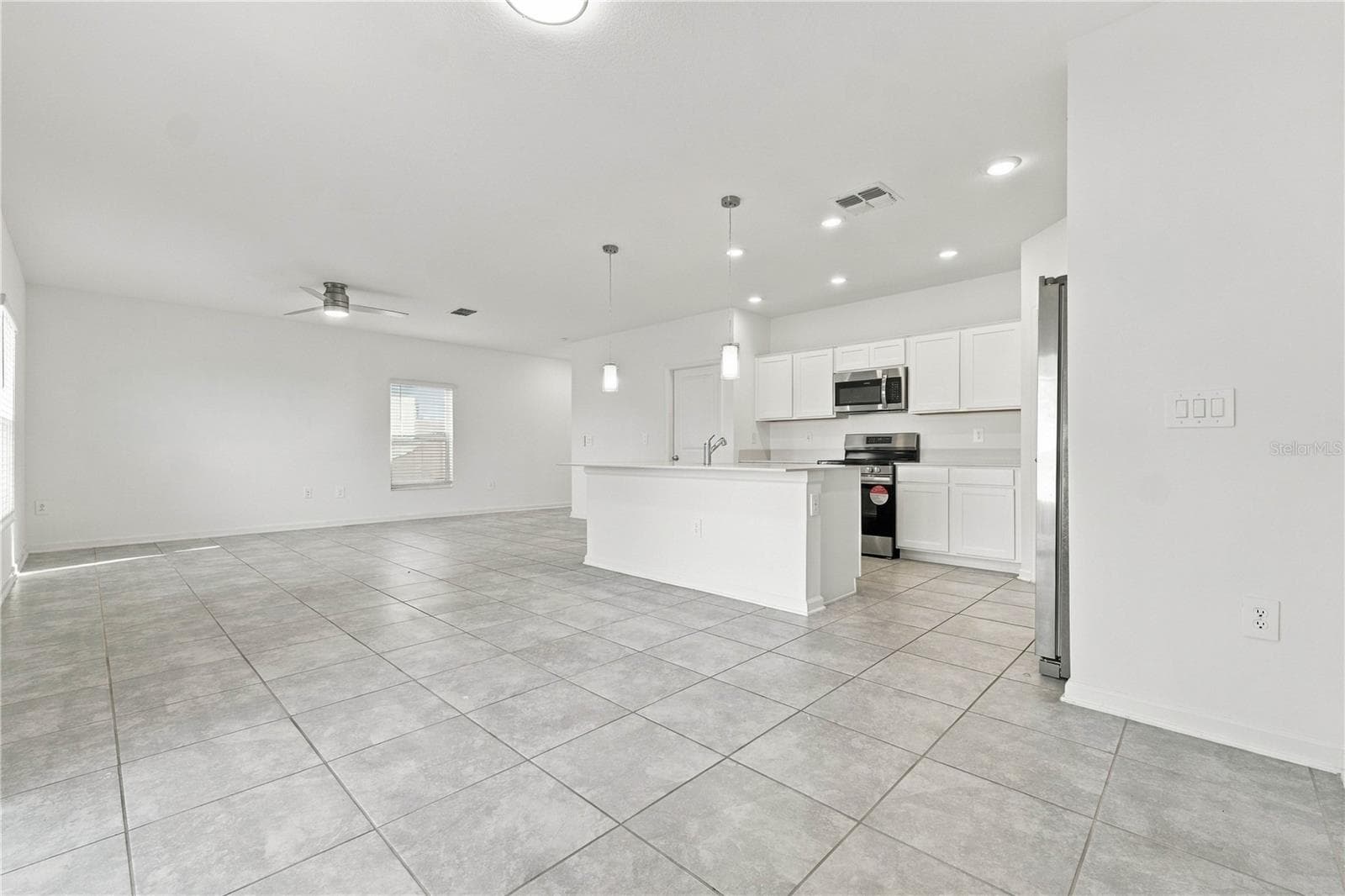 Kitchen Open to Living Area - 997 HAROLD PASS, WINTER HAVEN