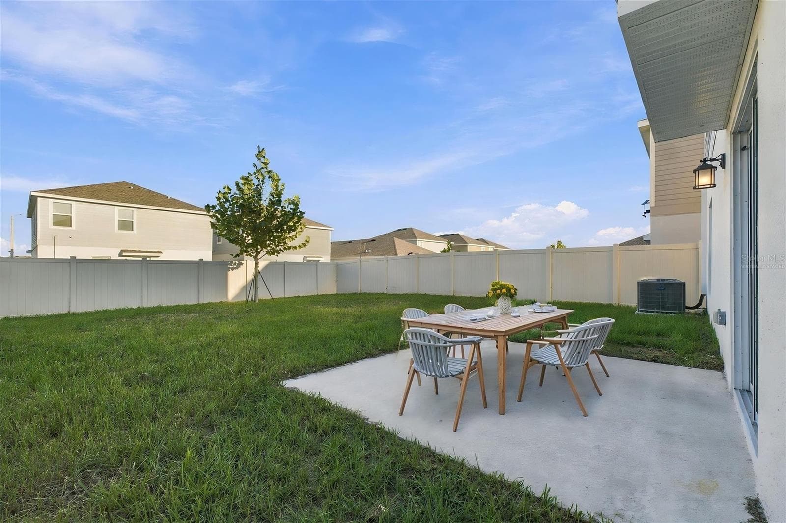 Back Patio and Fenced Yard - Virtually Staged - 997 HAROLD PASS, WINTER HAVEN