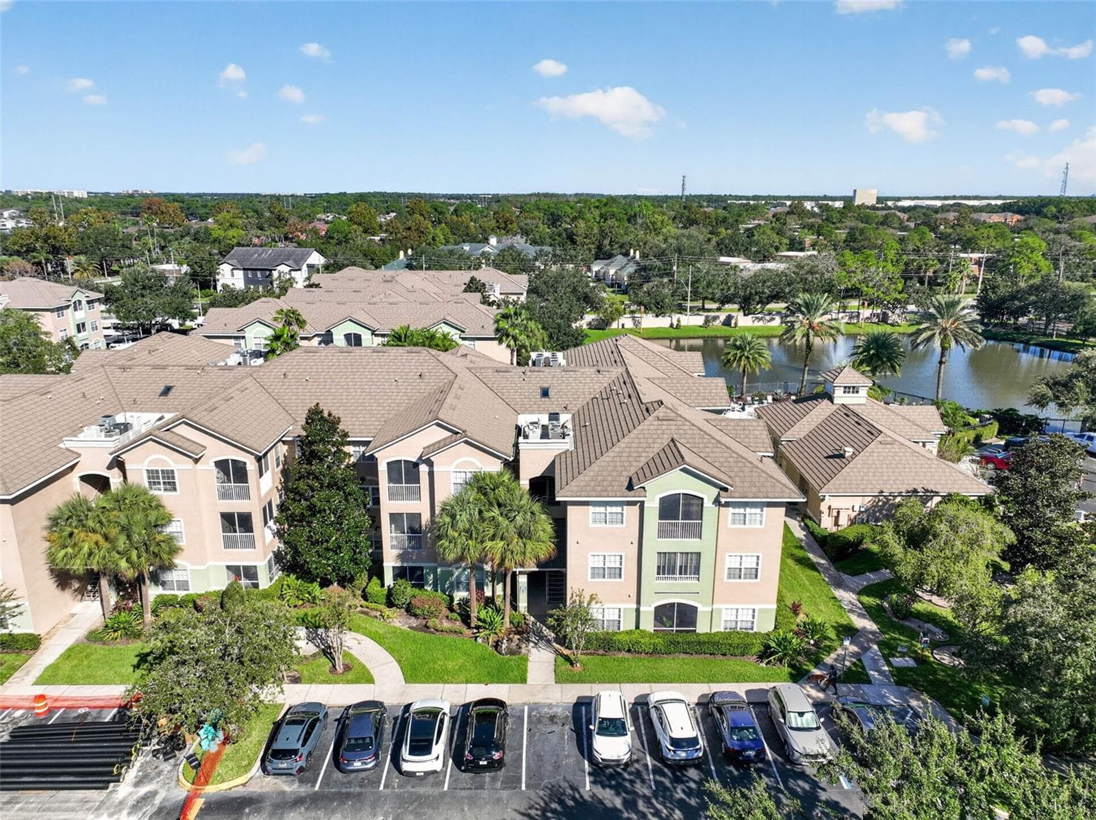 Aerial view of building and community pond - 4849 CYPRESS WOODS DR #1302, ORLANDO