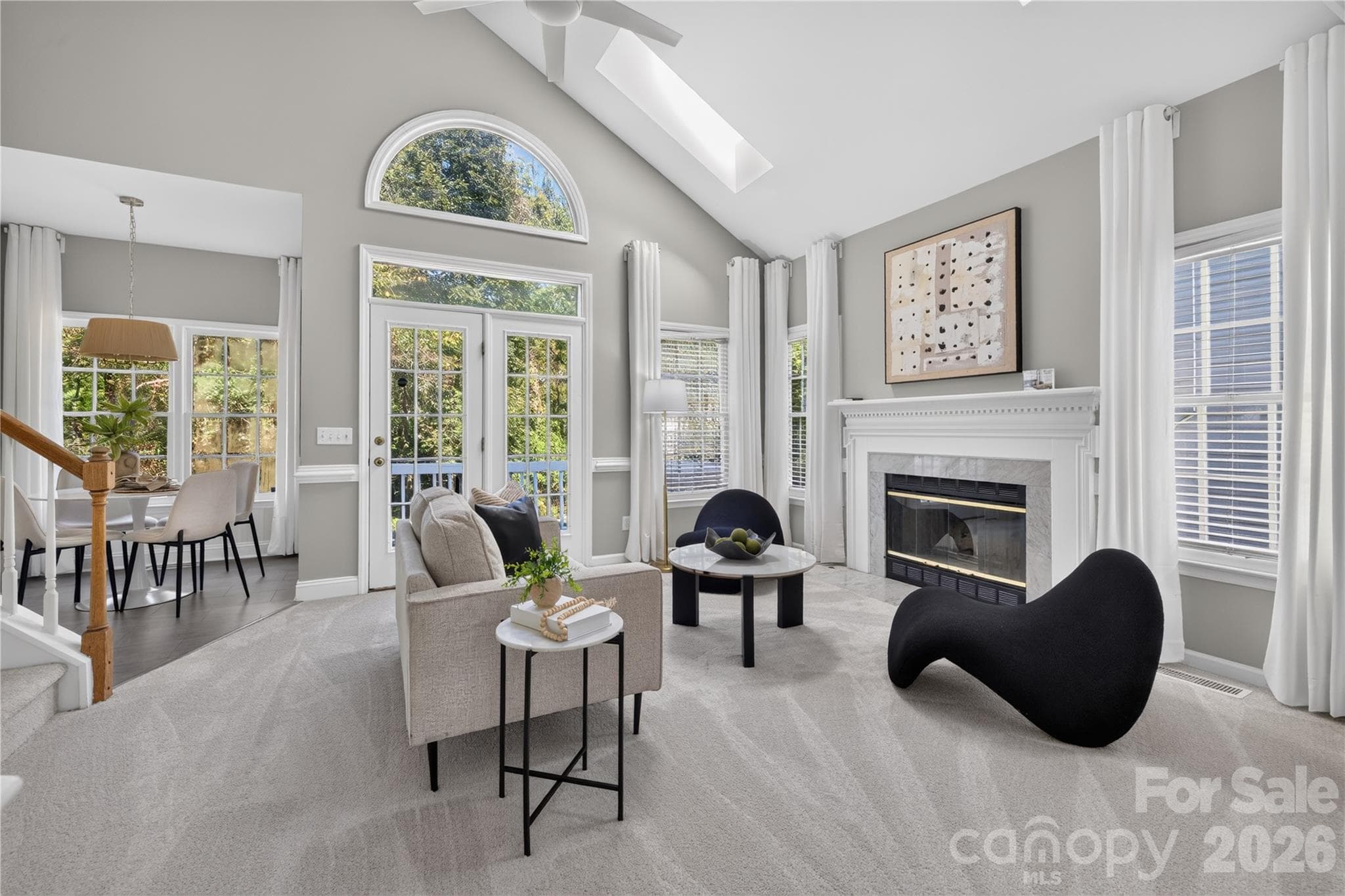 Great room complete with fireplace and French doors to the deck. - 4711 Beech Crest Place, Charlotte