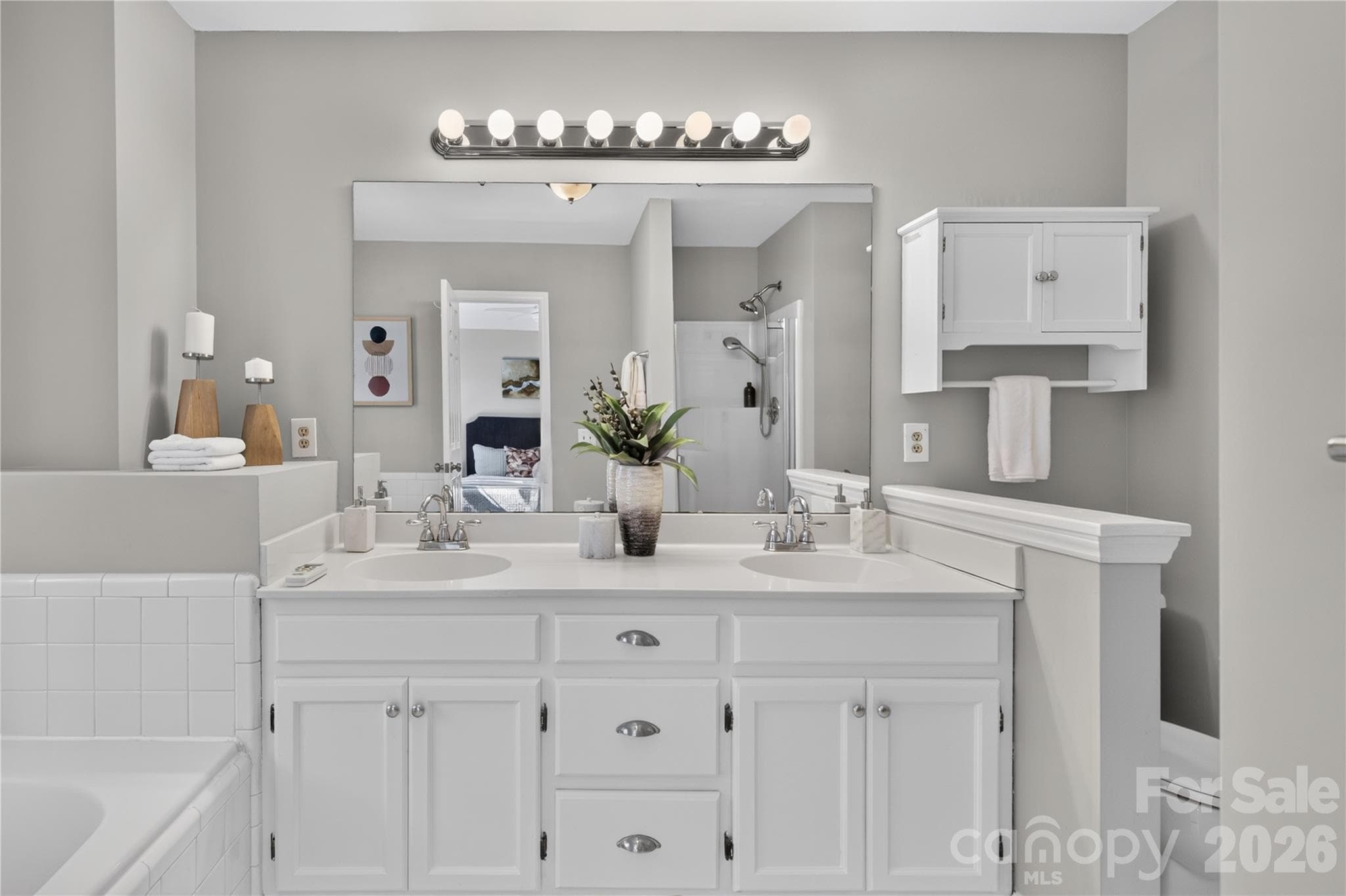 Spacious en suite bath with garden tub, dual vanity, new flooring and separate shower. - 4711 Beech Crest Place, Charlotte