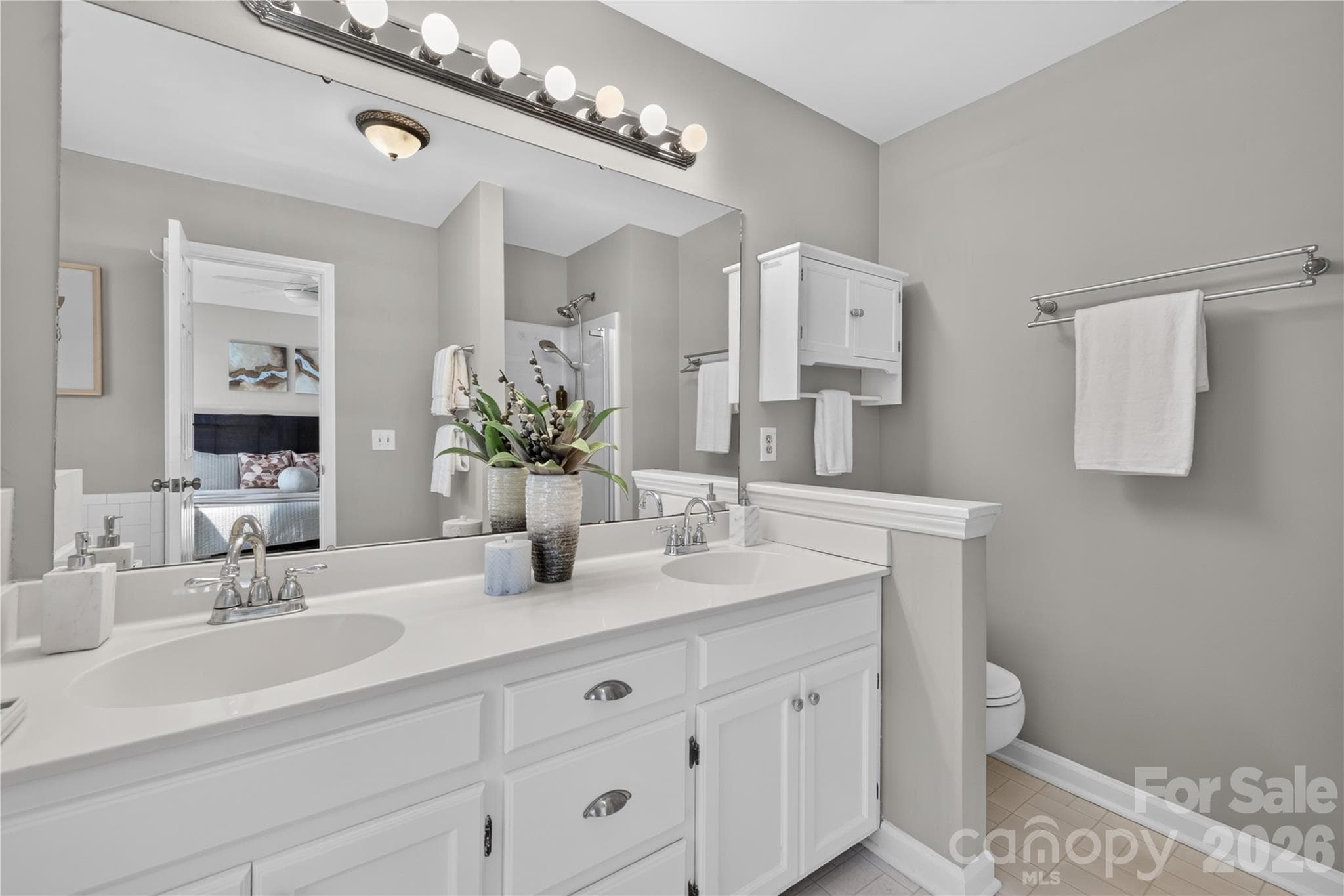 Spacious en suite bath with garden tub, dual vanity, new flooring and separate shower. - 4711 Beech Crest Place, Charlotte