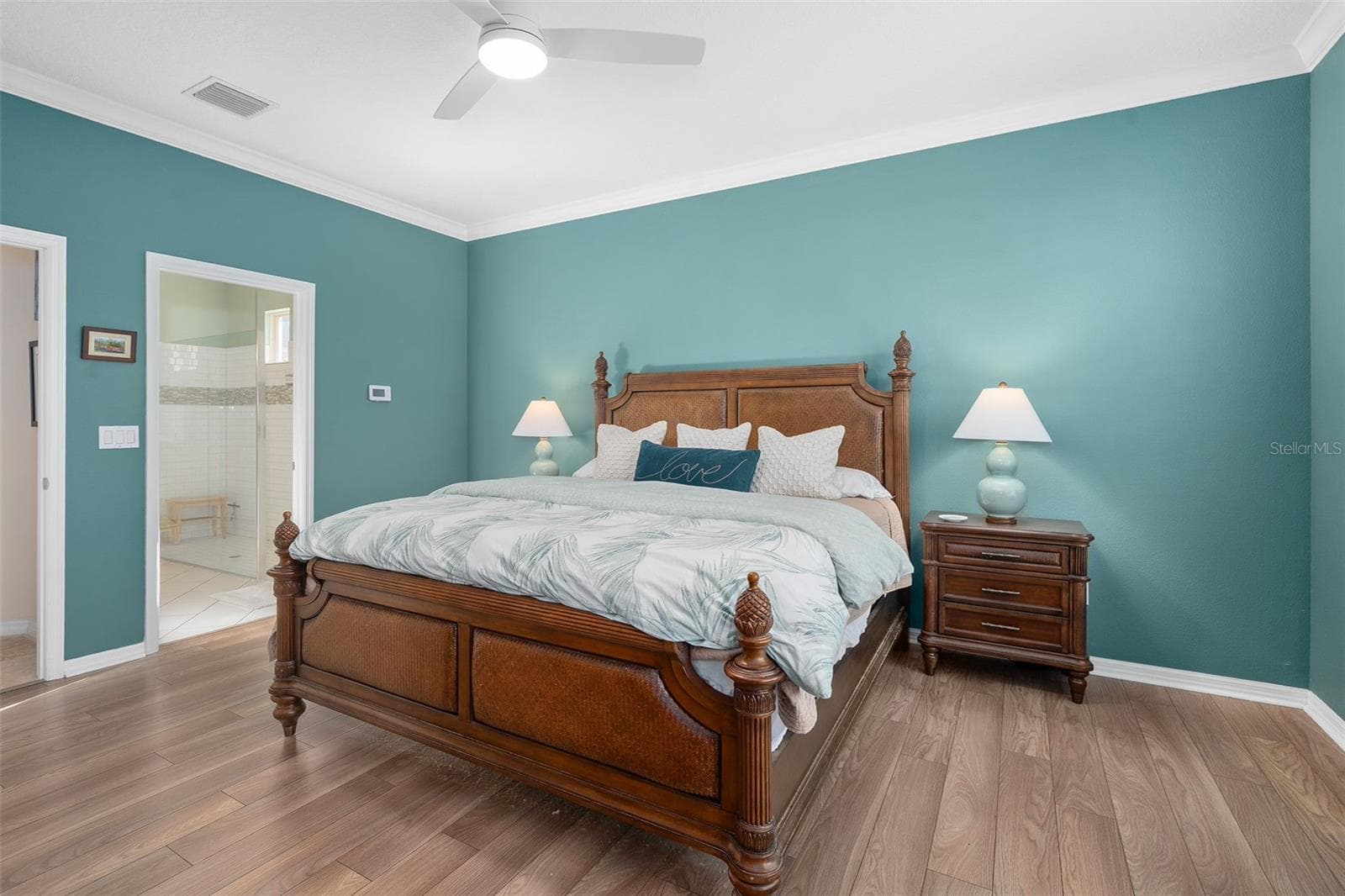 Primary Bedroom suite with Luxury Vinyl Plank Flooring Crown Molding with a view of the Primary En-Suite - 1038 TIMBERVALE TRL, CLERMONT