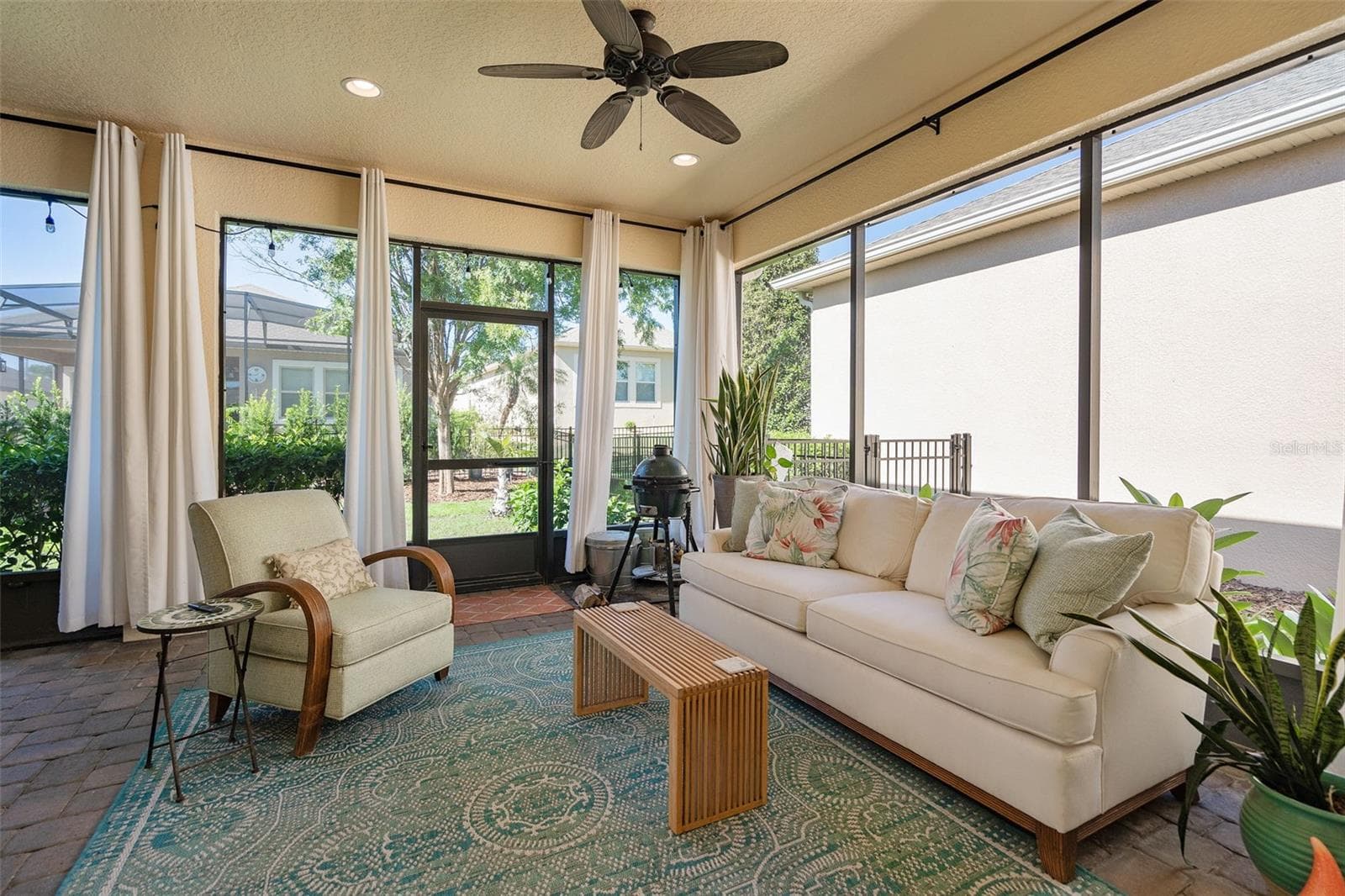 Enjoy the Screened Lanai with 2 Ceiling Fans and Pavers. There is also a Misting System outside for cooling off - 1038 TIMBERVALE TRL, CLERMONT