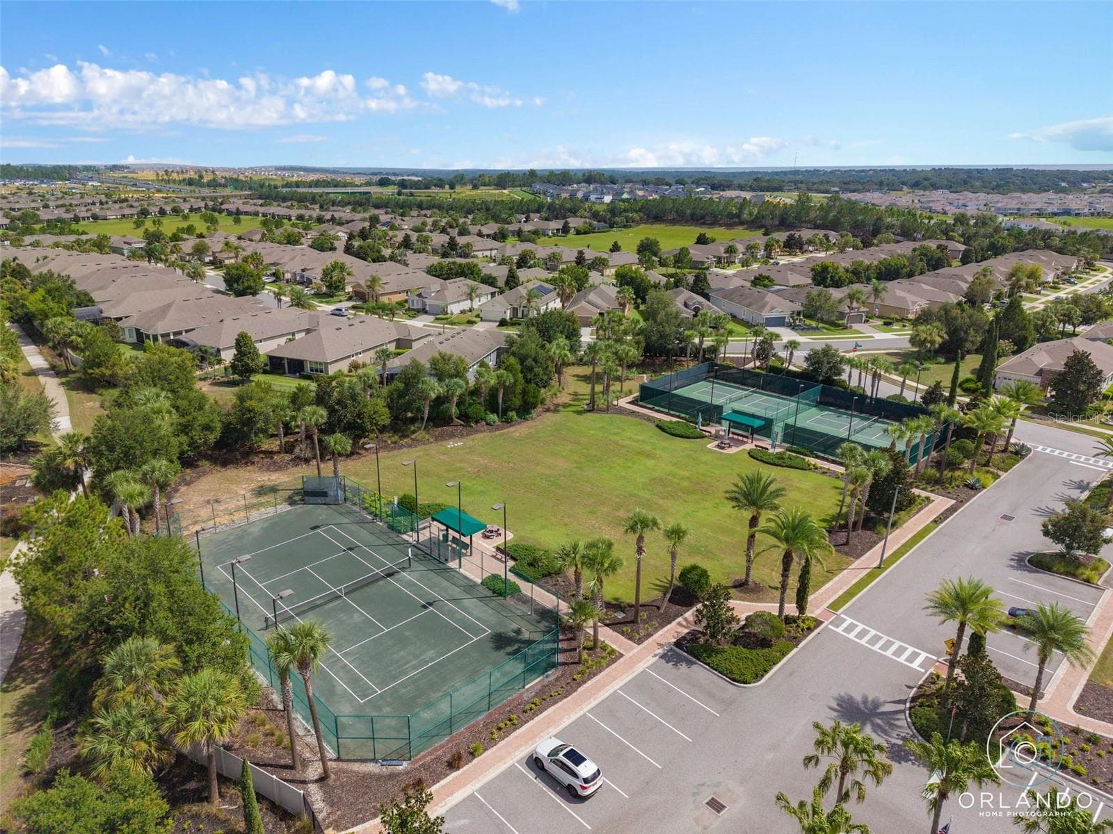 Clay Tennis Court. The Court is lighted for nighttime play. - 1038 TIMBERVALE TRL, CLERMONT