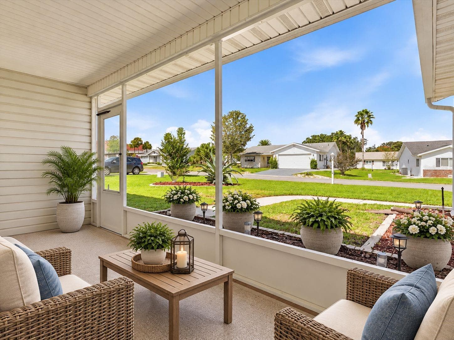 Virtually Staged - Screened Front Porch perfect for morning coffee and chatting with neighbors. - 9892 SE 177TH LN, SUMMERFIELD
