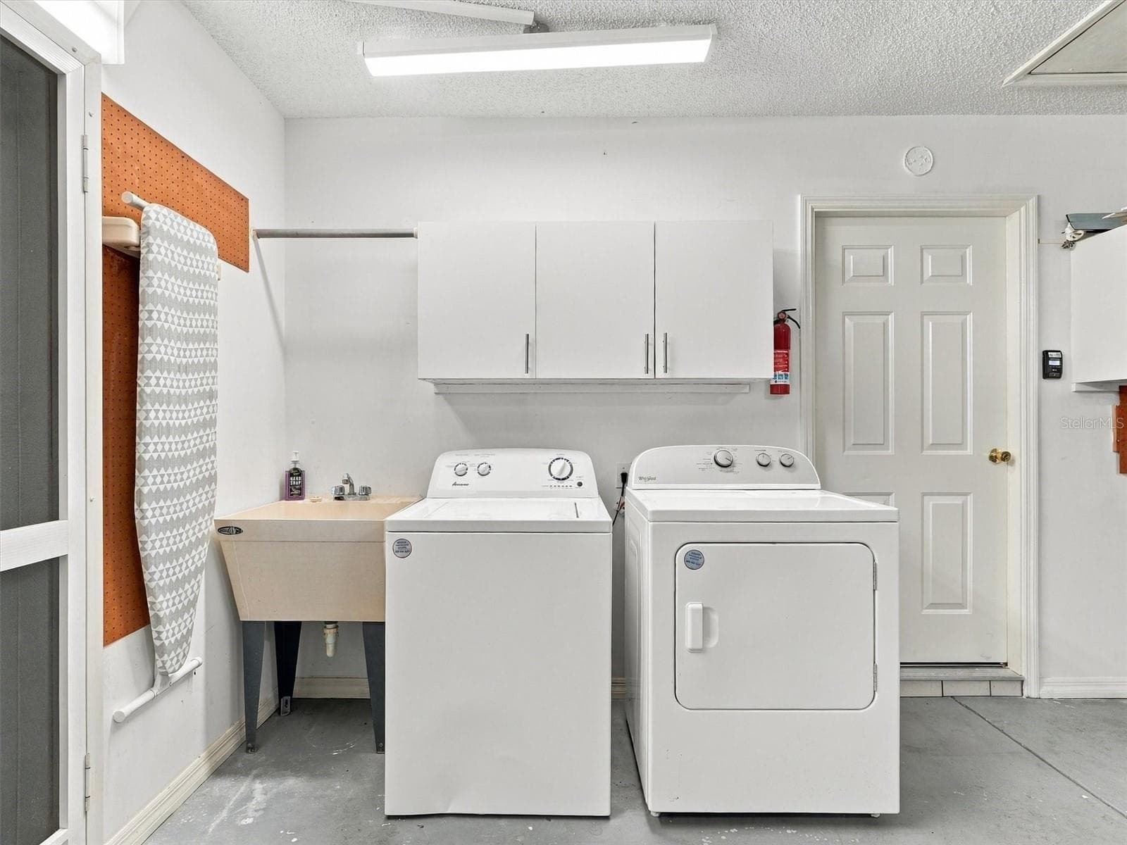 Washer & Dryer, and Wash Tub - side door in garage - 9892 SE 177TH LN, SUMMERFIELD