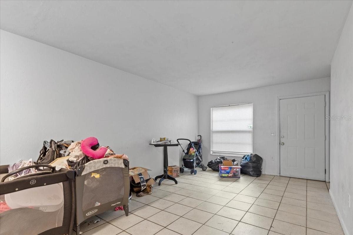 Large downstairs living and dining room. - 7034 SW 17TH PL, GAINESVILLE