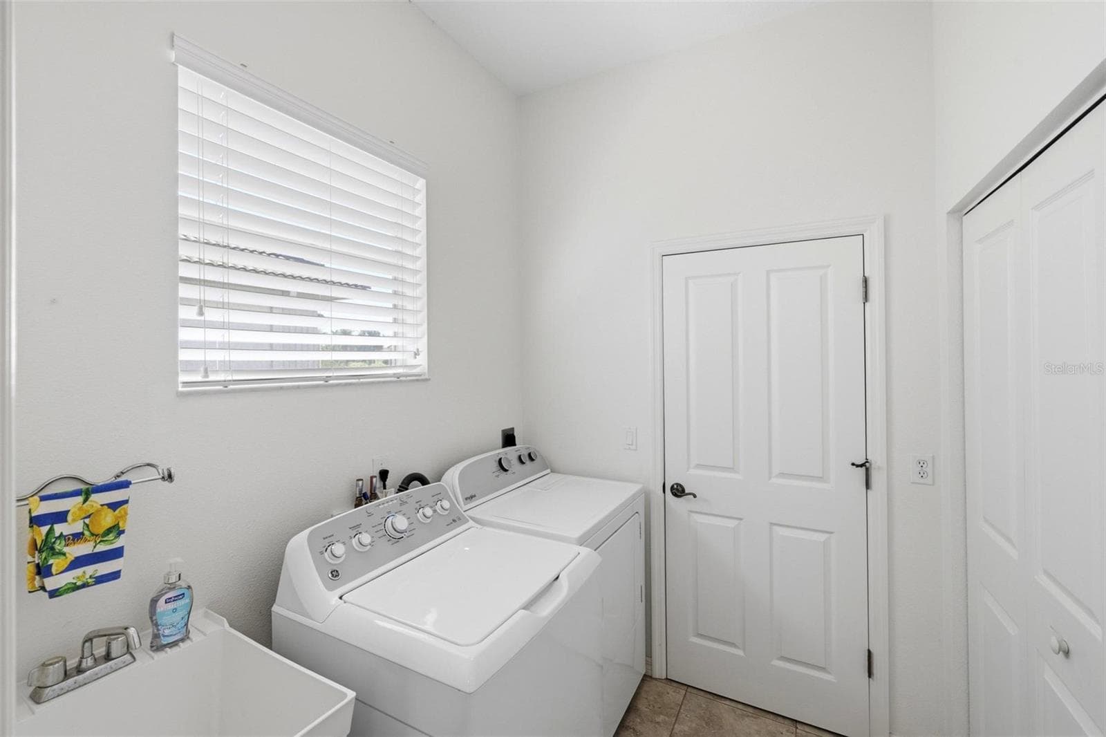 Laundry room with large double closet - pantry/untility - 687 LAKESCENE DR, VENICE