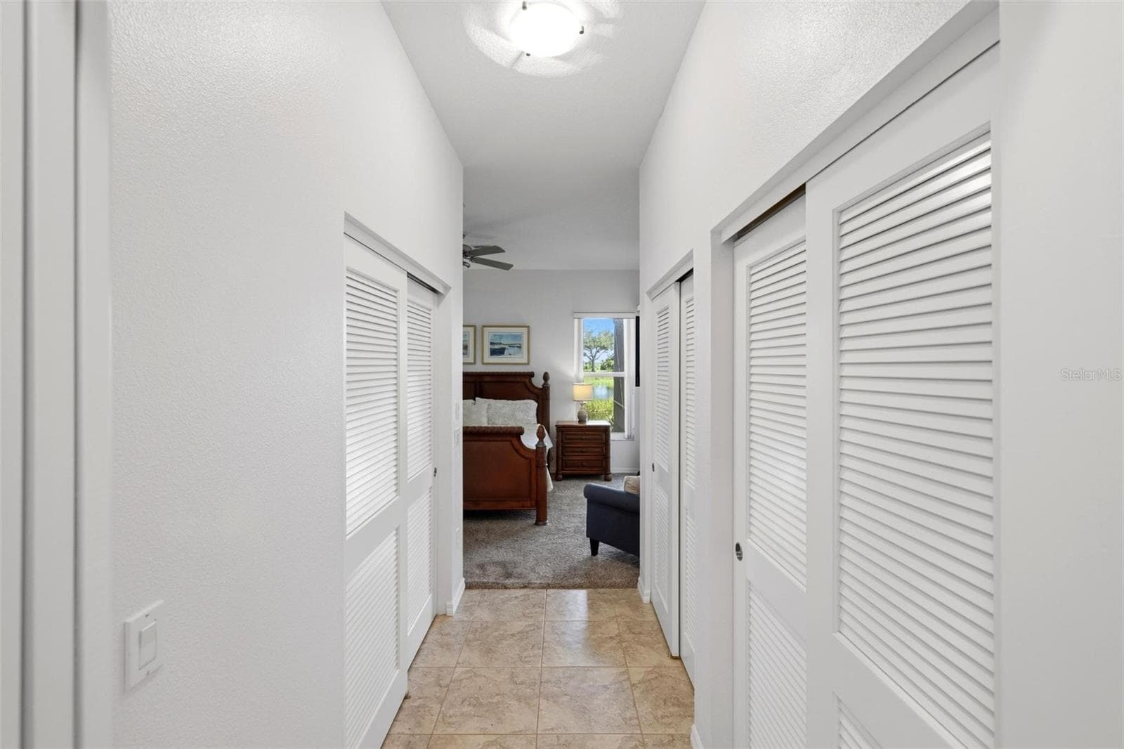 Entry to primary bedroom with 3 spacious closets - 687 LAKESCENE DR, VENICE