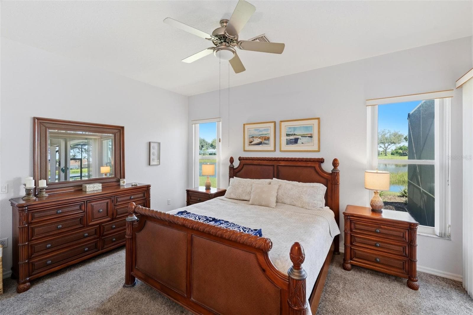 Primary bedroom with water views - 687 LAKESCENE DR, VENICE