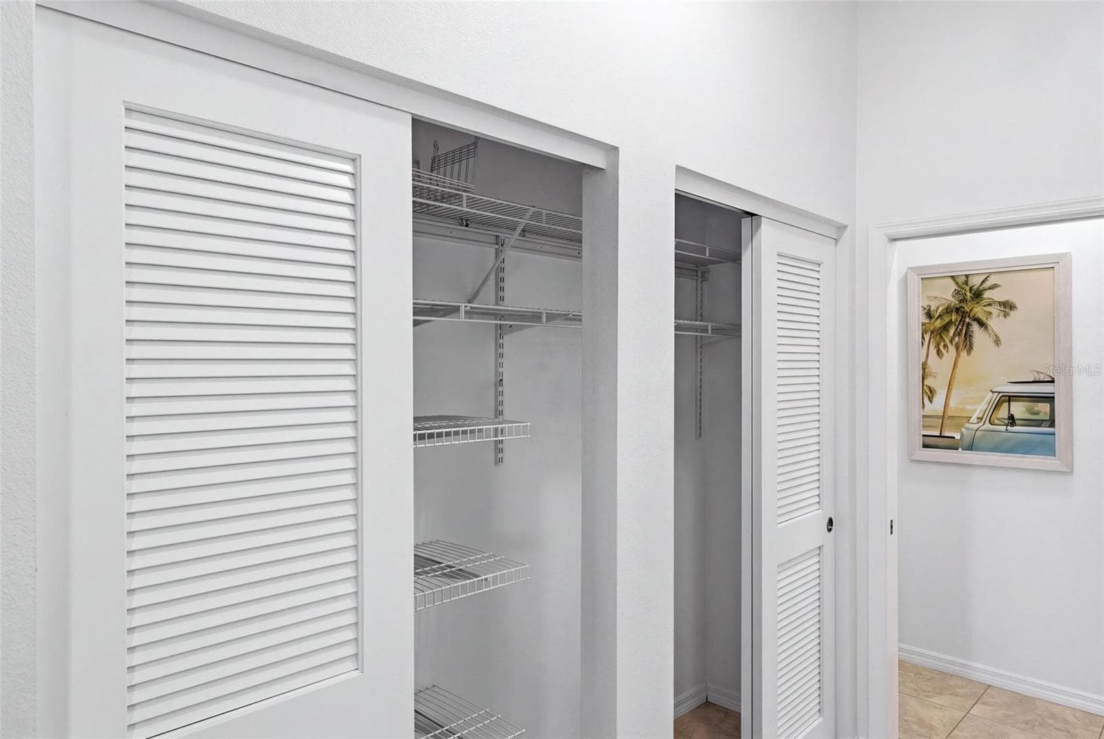 Primary bedroom closets - 687 LAKESCENE DR, VENICE