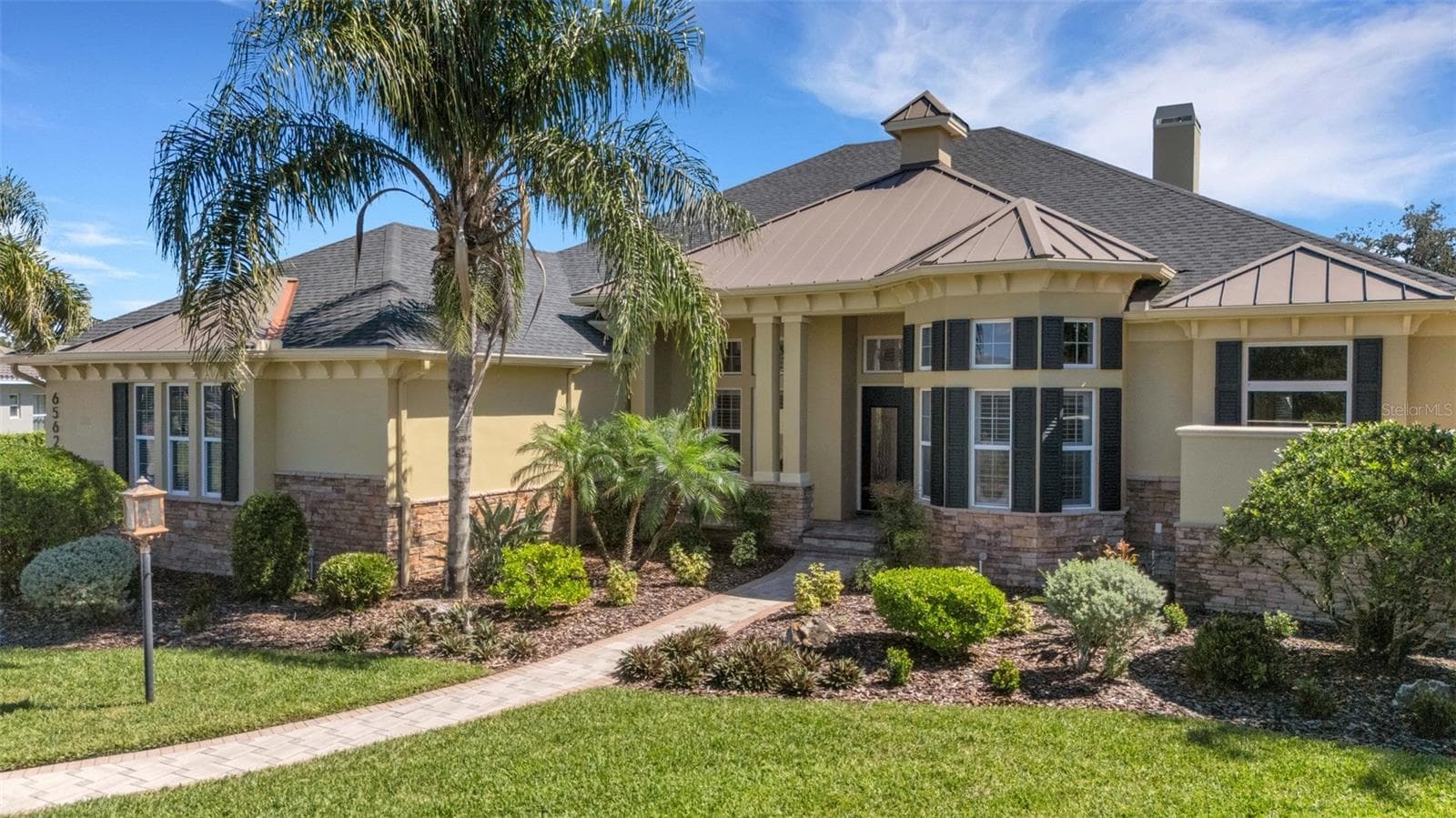 New roof in 2022 - notice the metal roofing accents! - 6562 EAGLE VIEW LOOP, LAKELAND