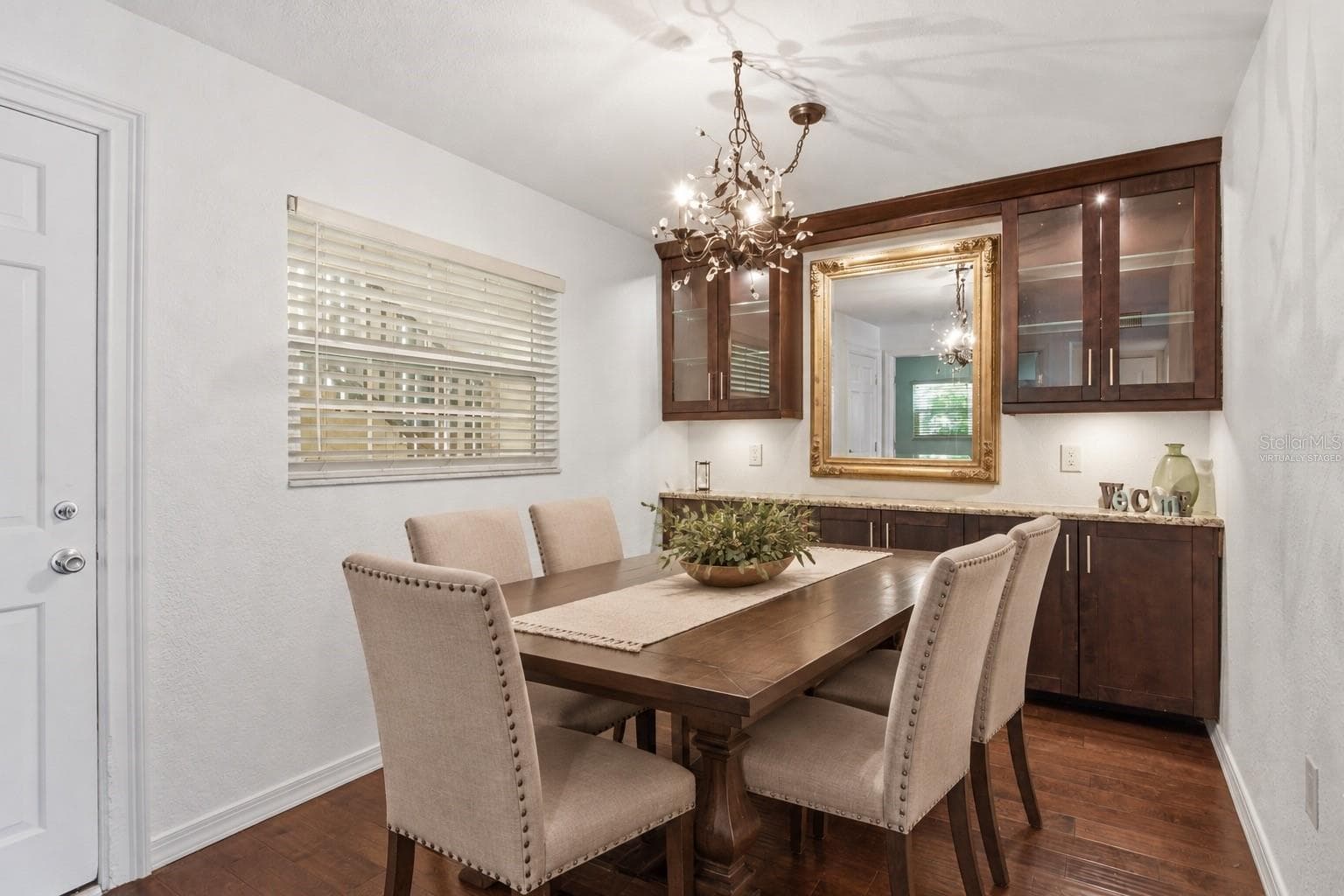 Dining room- Virtually staged table - 821 DELEON CT #109, DUNEDIN