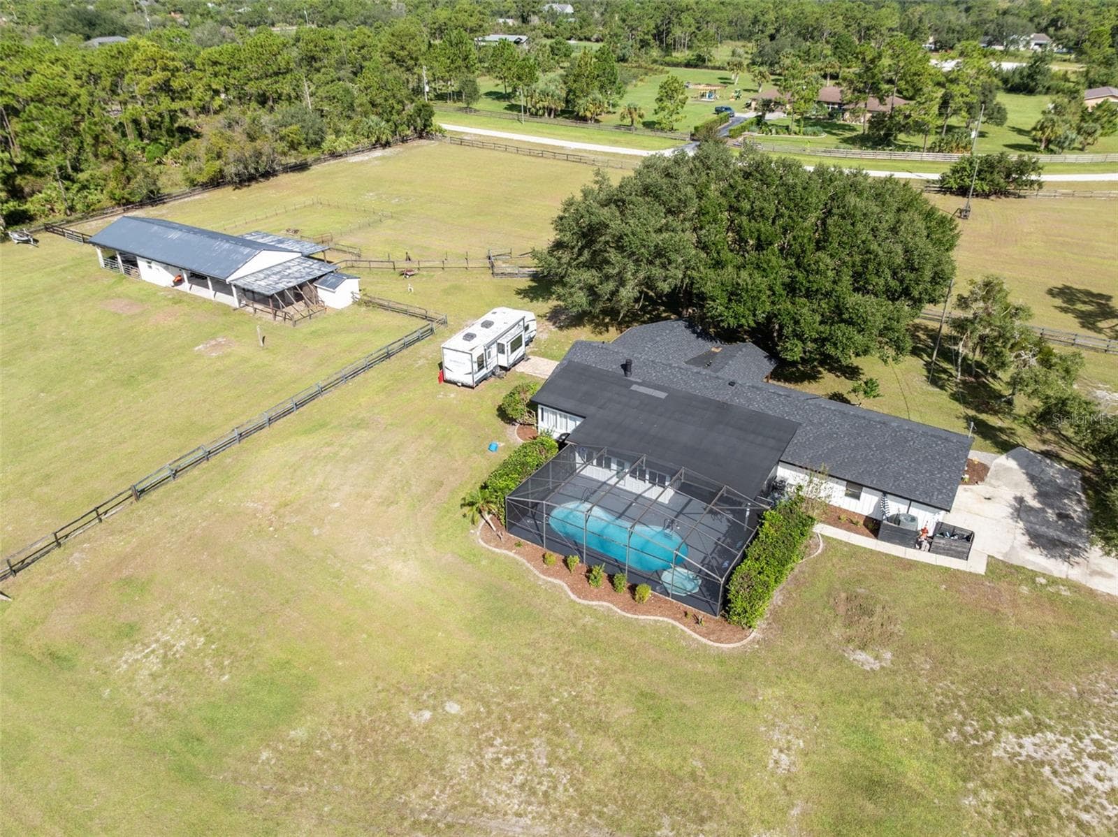 Home has a 3-stall barn and fenced pastures - 2670 MILLS CREEK RD, CHULUOTA