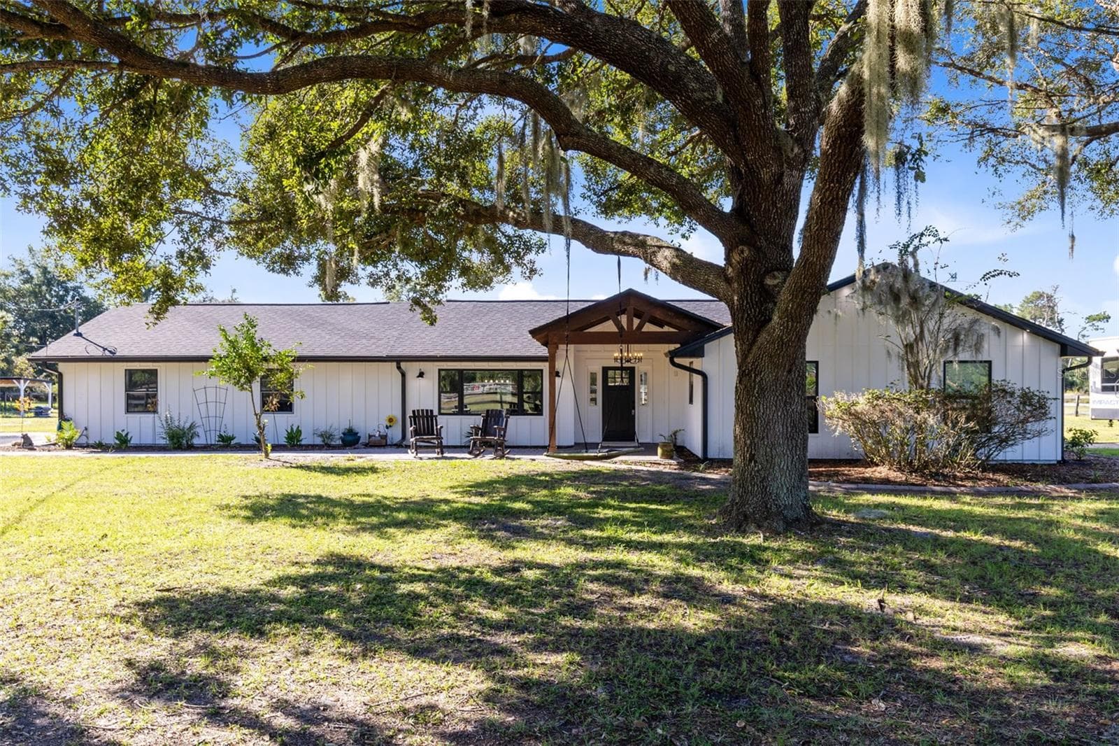 Fully renovated, craftsman style home with Hardie board-and-batten siding. - 2670 MILLS CREEK RD, CHULUOTA