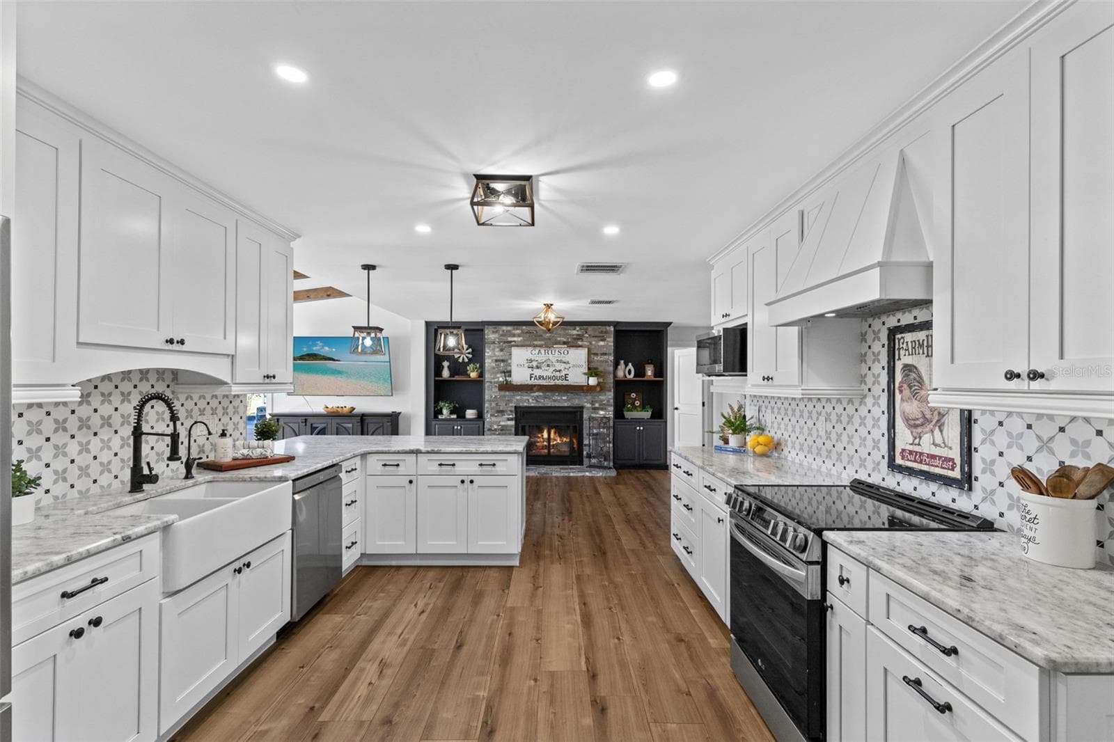 Expansive Kitchen with large Breakfast Bar with Dolomite countertops. - 2670 MILLS CREEK RD, CHULUOTA