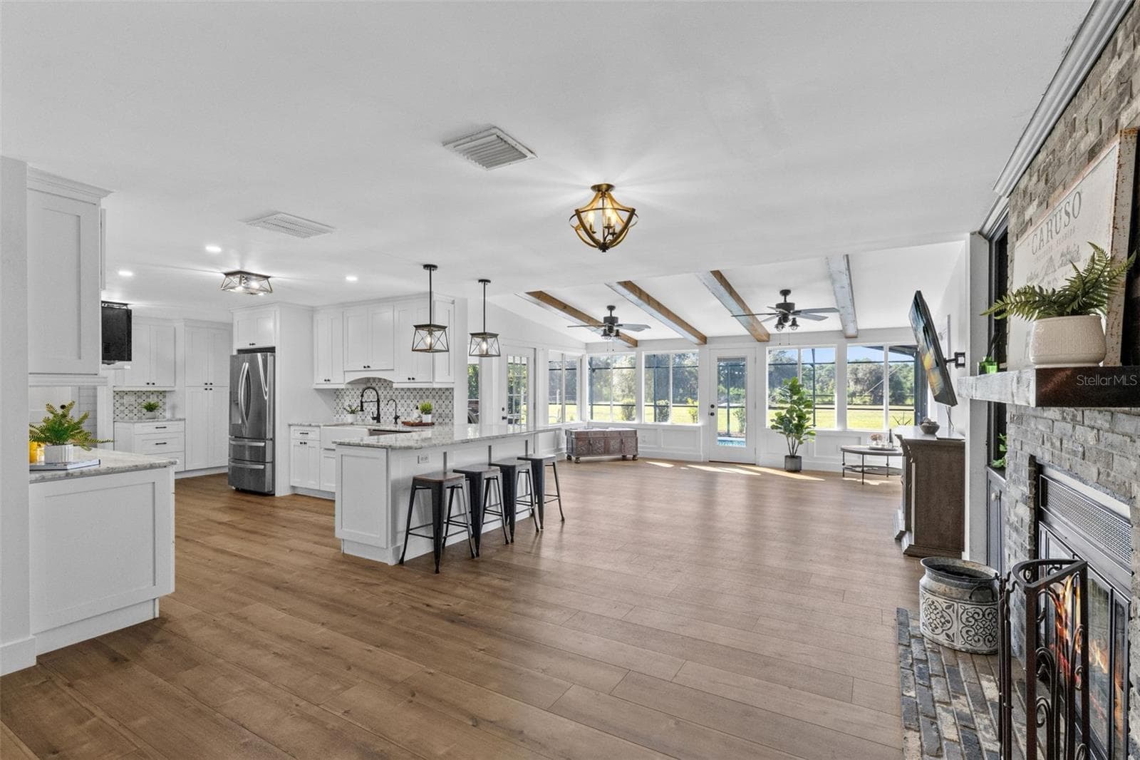 Large Family Room with lots of windows to enjoy the view of your back parcel - 2670 MILLS CREEK RD, CHULUOTA