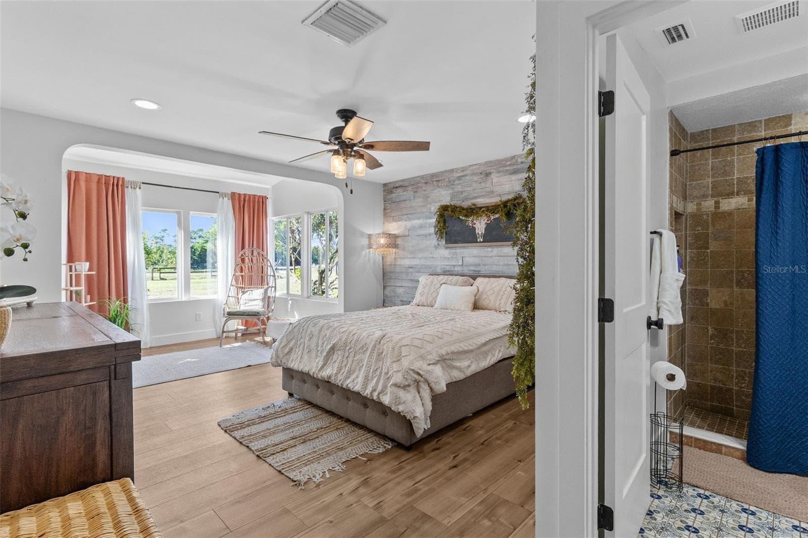 The lovely Primary Bedroom has a bright sitting area. Just beautiful! - 2670 MILLS CREEK RD, CHULUOTA