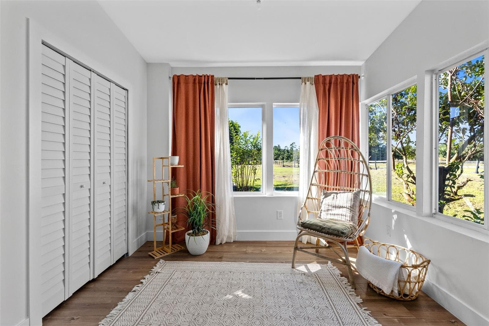 The sunny sitting area off the Primary Bedroom with Primary Closet number 2. - 2670 MILLS CREEK RD, CHULUOTA