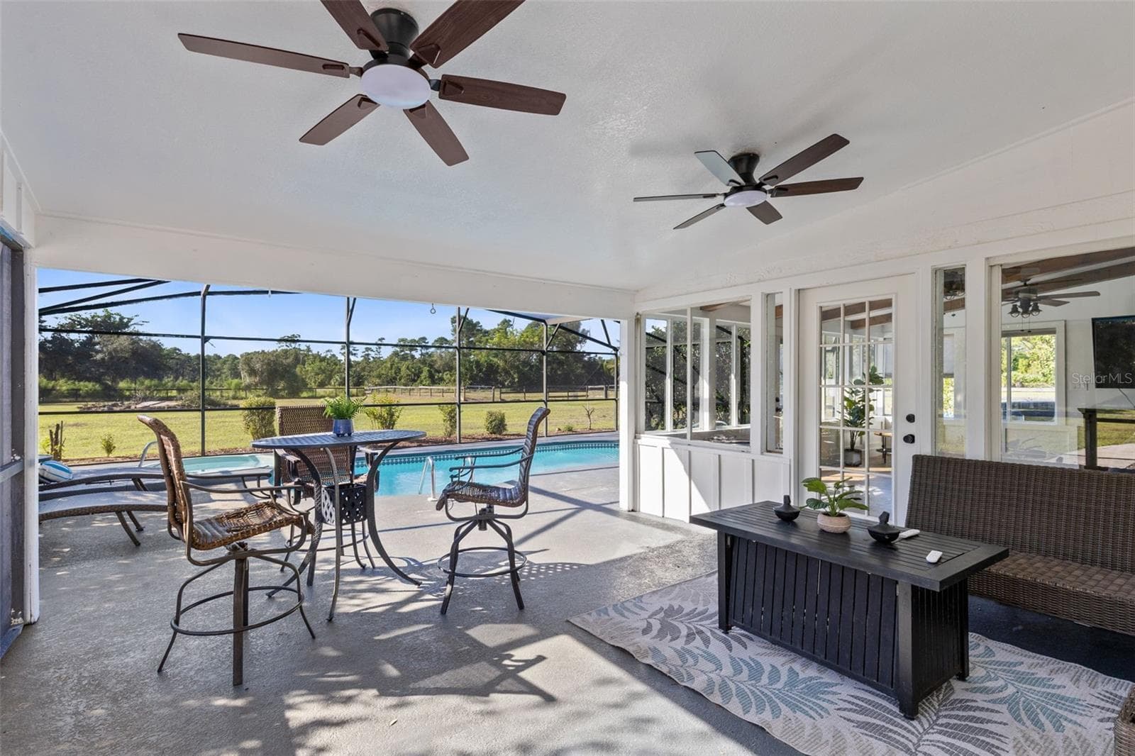 Great covered lanai area. Notice the lovely French Doors. - 2670 MILLS CREEK RD, CHULUOTA
