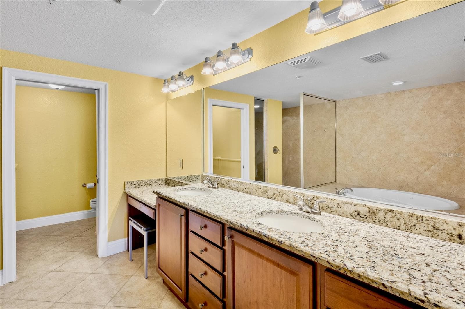 Primary bath with lots of storage, dual sinks and water closet. - 2825 TERRA CEIA BAY BLVD #1402, PALMETTO