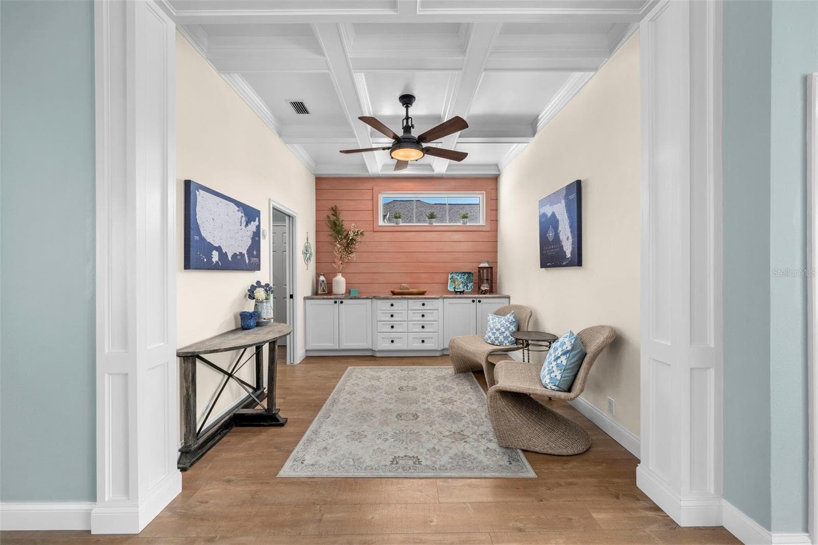 Coffered ceilings and custom built-ins give the den character and flexibility for work, reading, or relaxing. - 4739 COMPASS DR, BRADENTON
