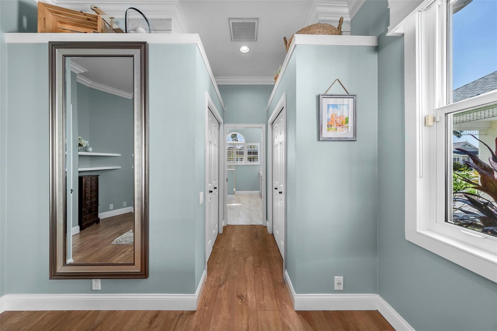 Two custom closets line the passage to the primary bath, keeping your daily routine comfortably organized. - 4739 COMPASS DR, BRADENTON