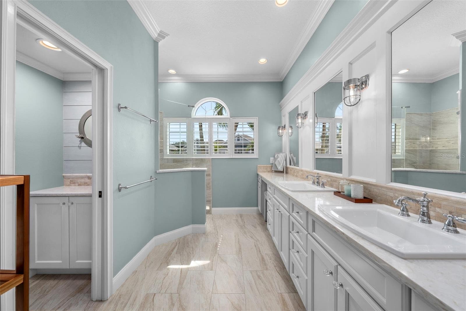 Beautifully renovated with a spacious vanity, soft coastal colors, and natural light for a calming start to the day. - 4739 COMPASS DR, BRADENTON