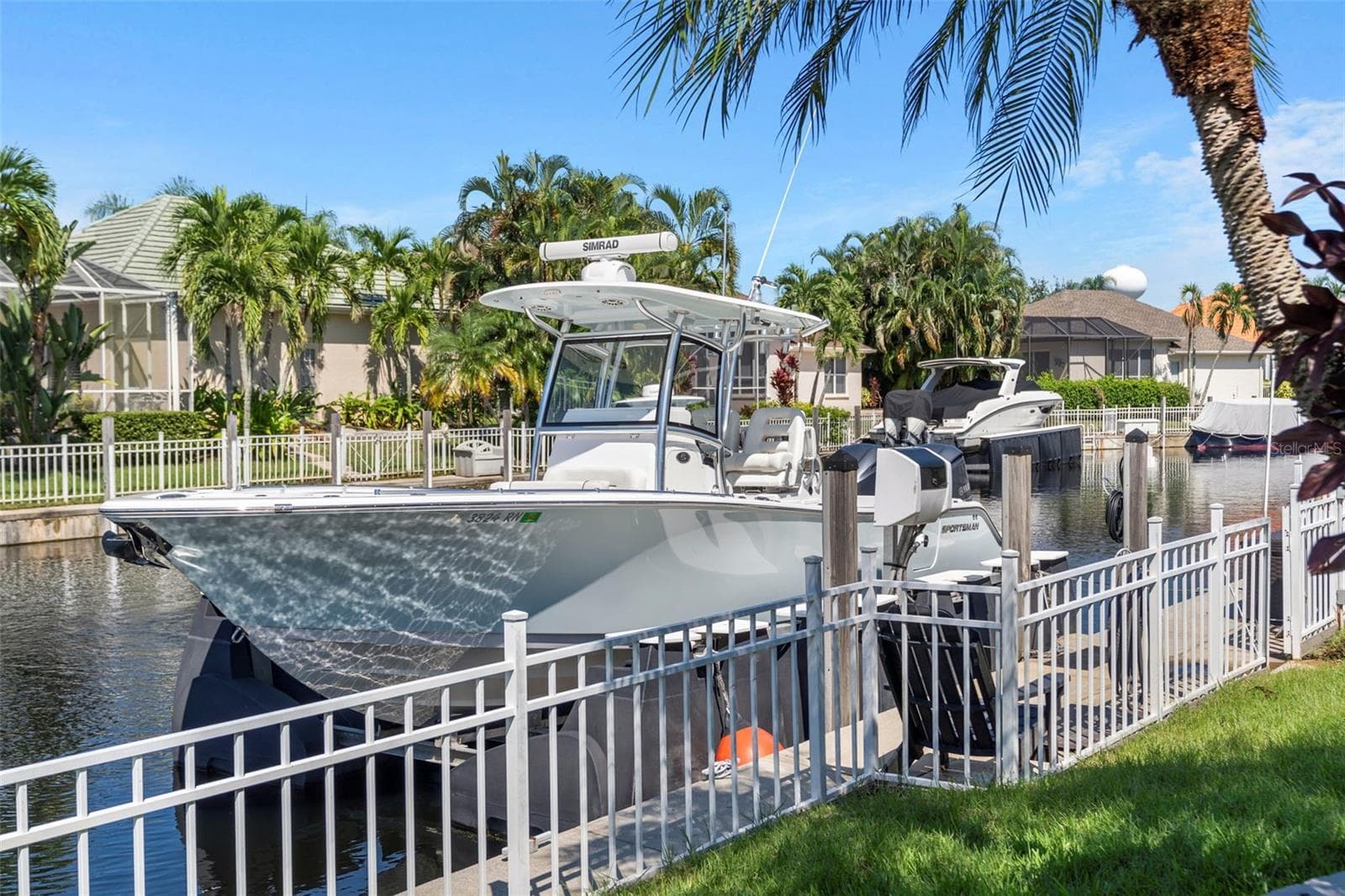 Your private dock includes water and electric, adding everyday convenience to life along the canal. - 4739 COMPASS DR, BRADENTON