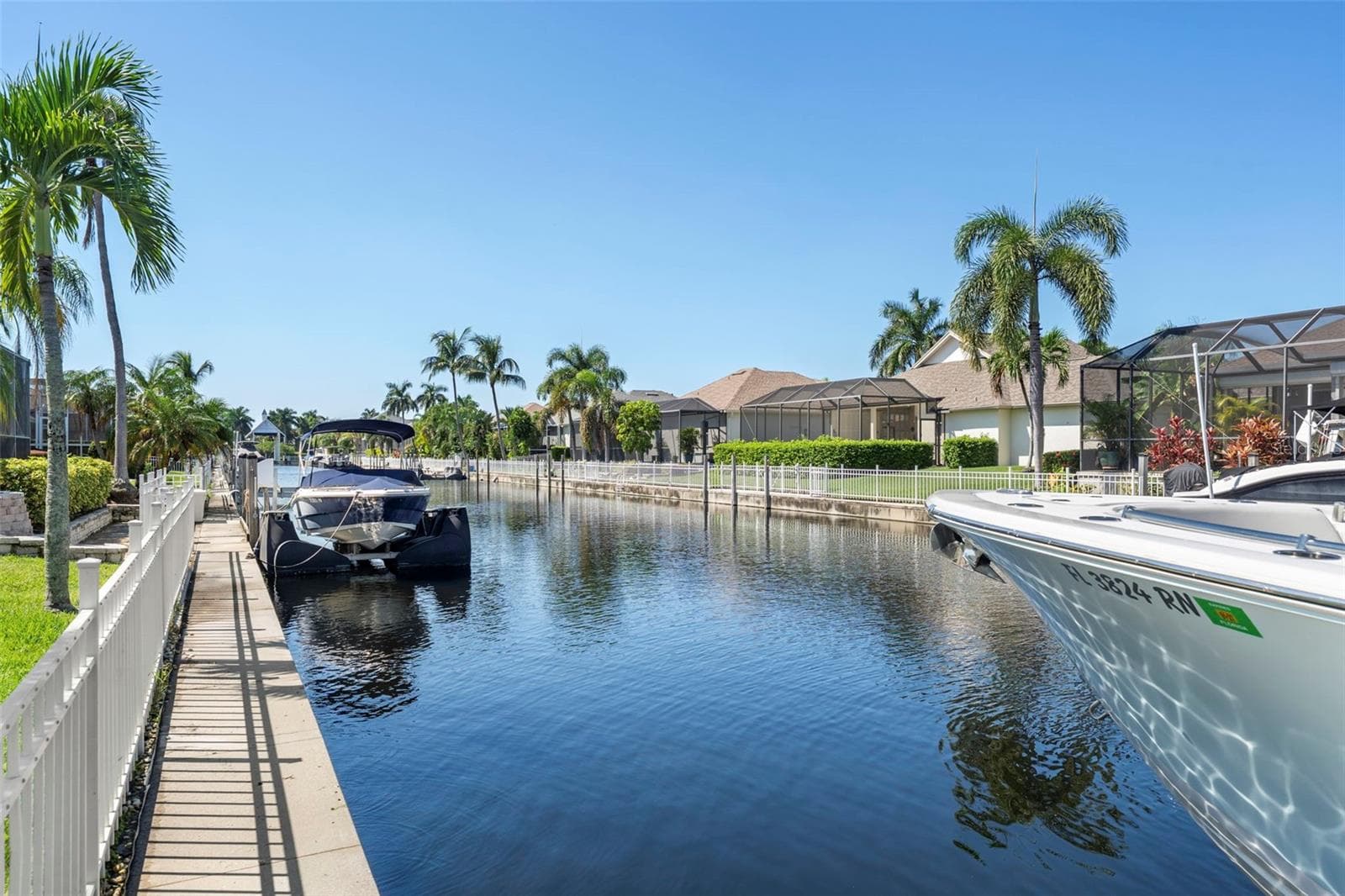 Your private dock includes water and electric, adding everyday convenience to life along the canal. - 4739 COMPASS DR, BRADENTON
