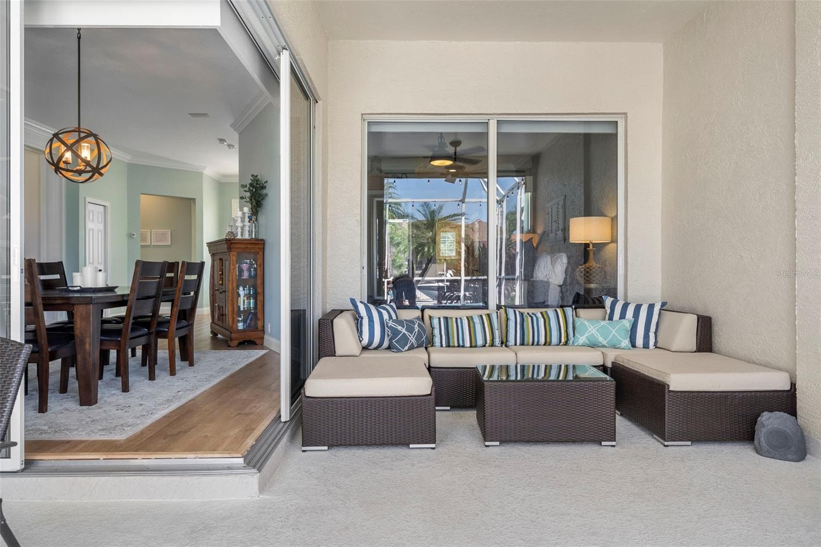 An inviting covered nook extends your living space outdoors—perfect for a good book or catching up with friends. - 4739 COMPASS DR, BRADENTON
