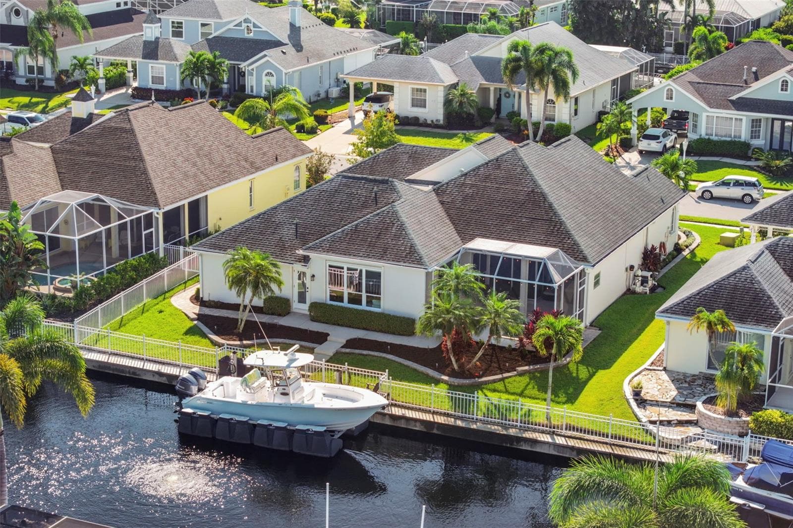 An aerial perspective of the home’s freshwater canal setting, with 75 feet of waterfront and boating access through the community canal and lift system. - 4739 COMPASS DR, BRADENTON