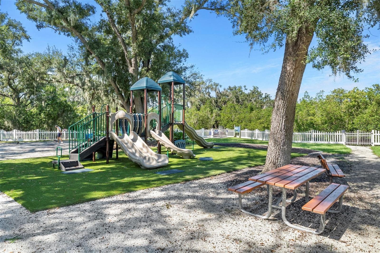 A shaded playground and picnic area provide a welcoming place to play, gather, and enjoy the neighborhood. - 4739 COMPASS DR, BRADENTON