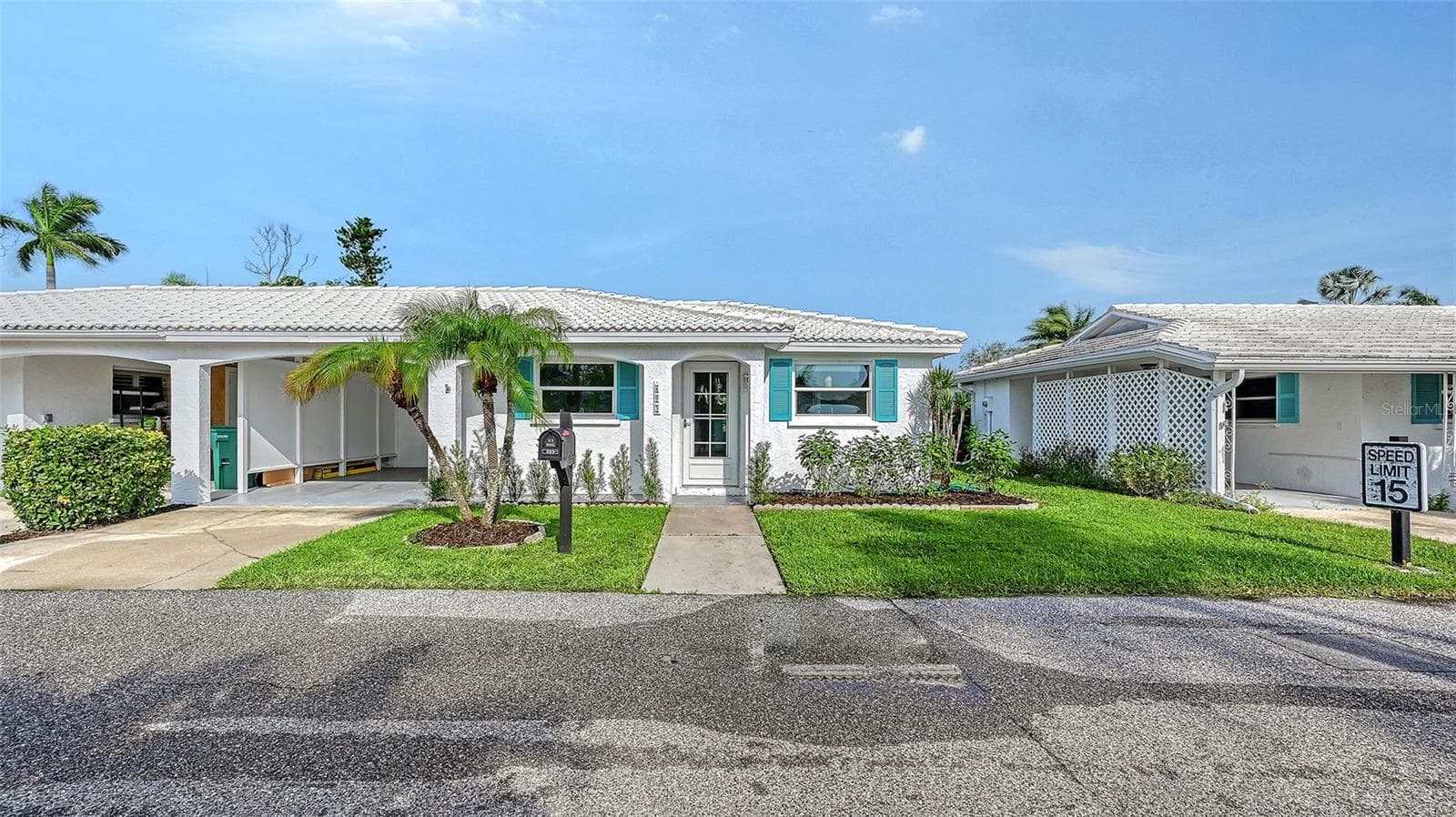 The front of the villa with carport. - 693 SPANISH DR N #24, LONGBOAT KEY