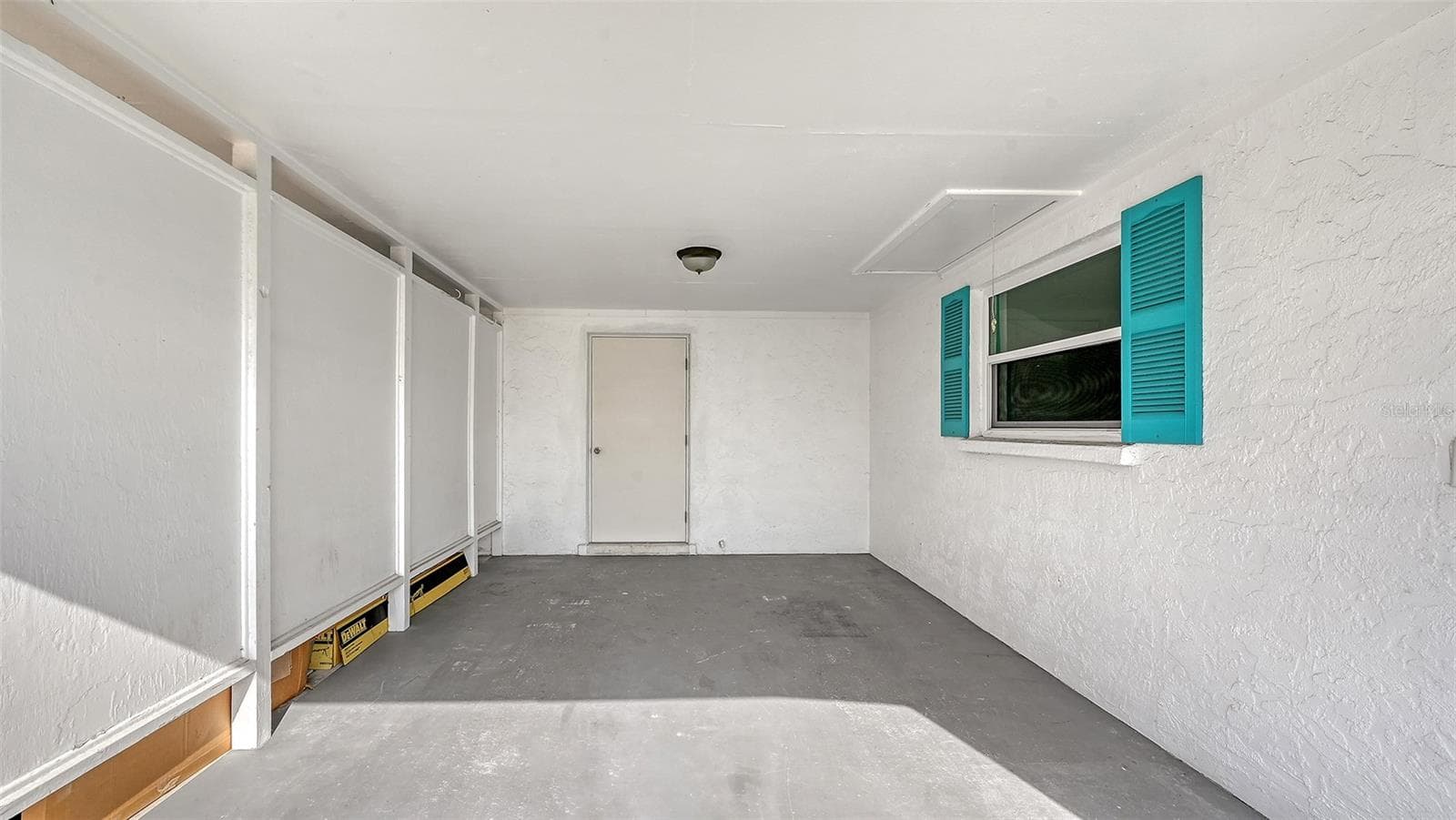Carport with storage room. - 693 SPANISH DR N #24, LONGBOAT KEY