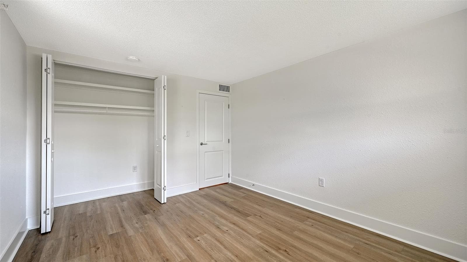 Guest bedroom (bedroom two) with built-in closet. - 693 SPANISH DR N #24, LONGBOAT KEY