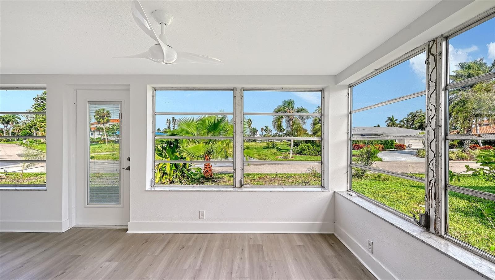 Lanai with doorway to the rear yard. - 693 SPANISH DR N #24, LONGBOAT KEY
