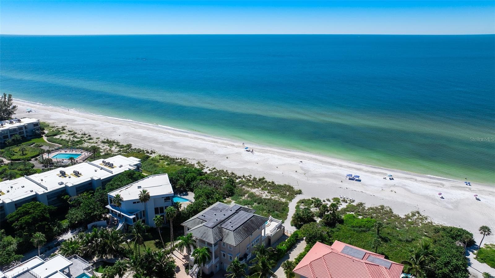 Spanish Main beach access - deeded path between red roof on the right and grey roof on the left. - 693 SPANISH DR N #24, LONGBOAT KEY