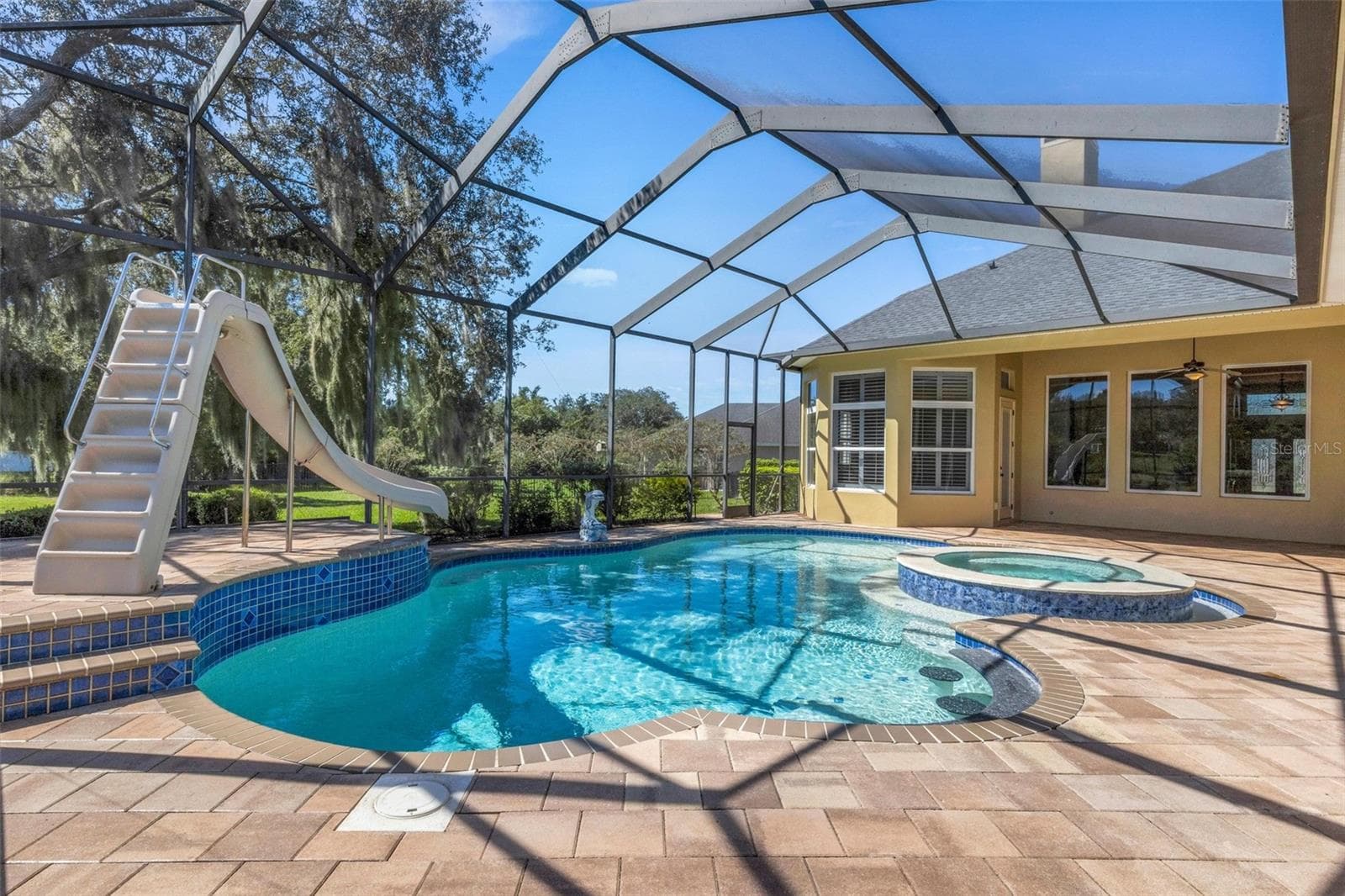 a spa, beach area and water slide. - 6562 EAGLE VIEW LOOP, LAKELAND