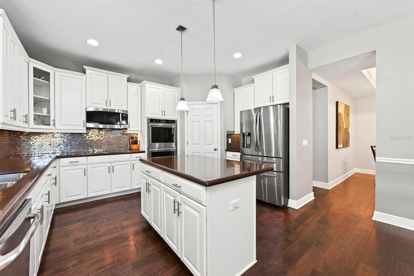 Ample cabinet, counter and storage space. - 4443 PINE GOLD AVE, APOPKA