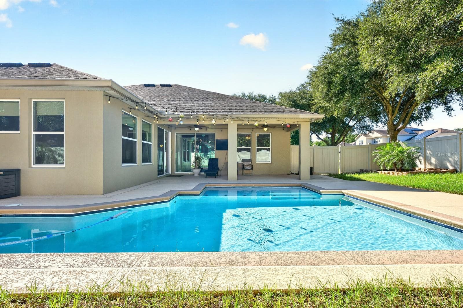 The covered lanai overlooks your private pool and privacy fenced backyard. - 4443 PINE GOLD AVE, APOPKA